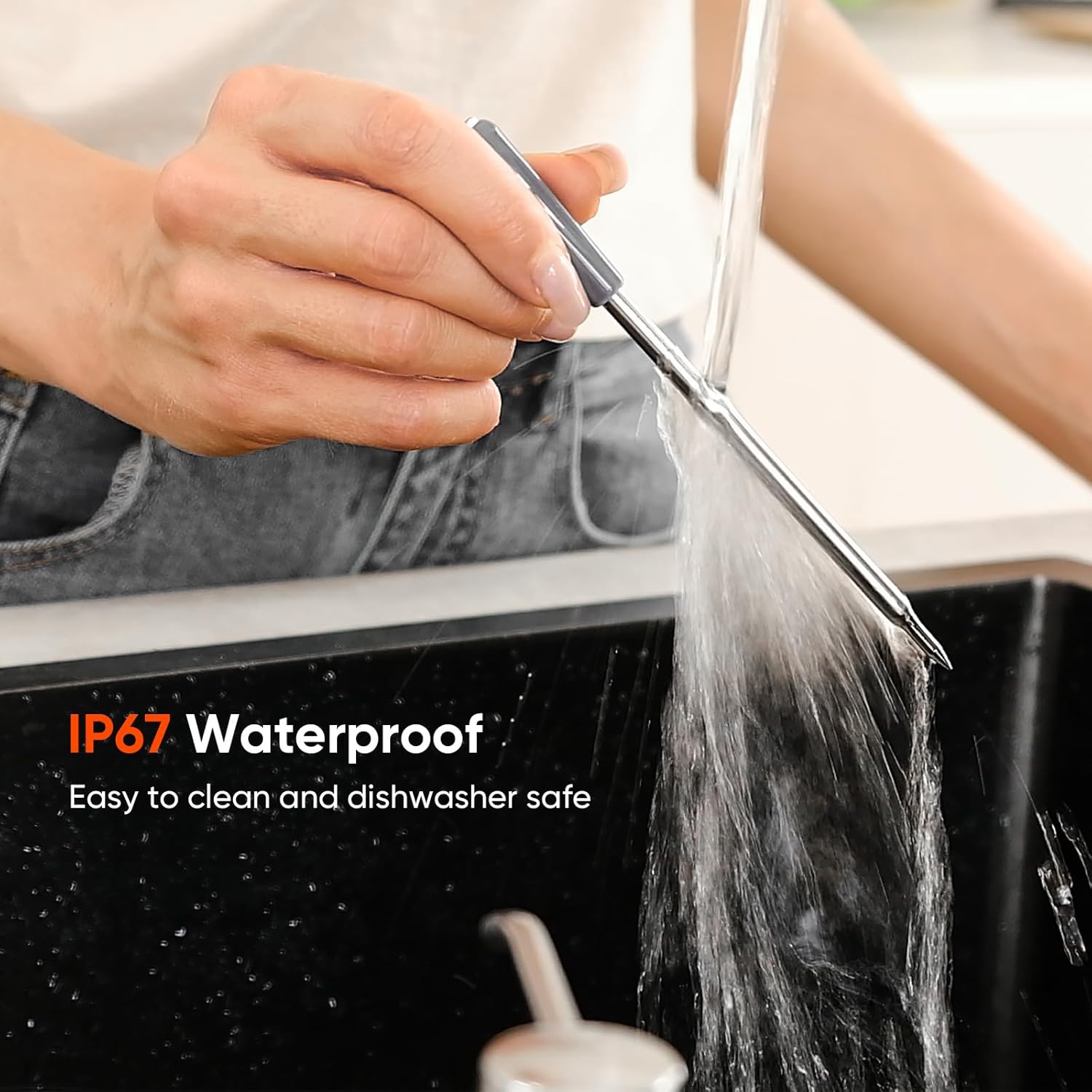 Wotintde meat thermometer probe being rinsed under running water