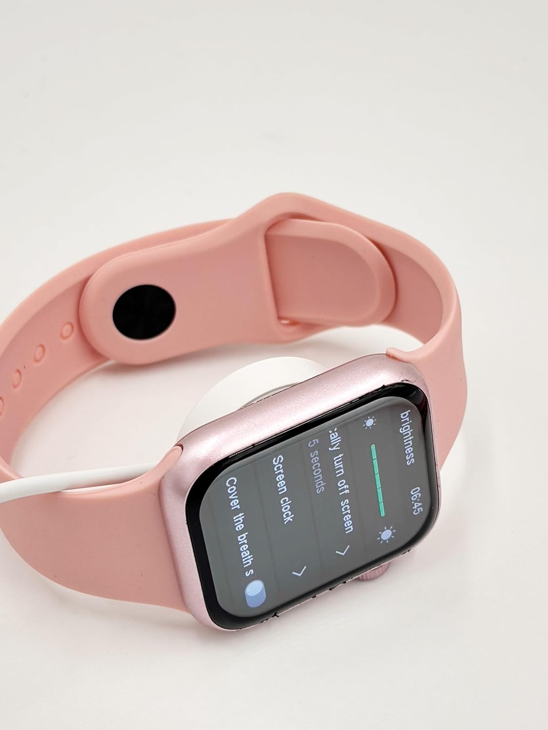 X10 MINI Smart Watch on its wireless charging pad