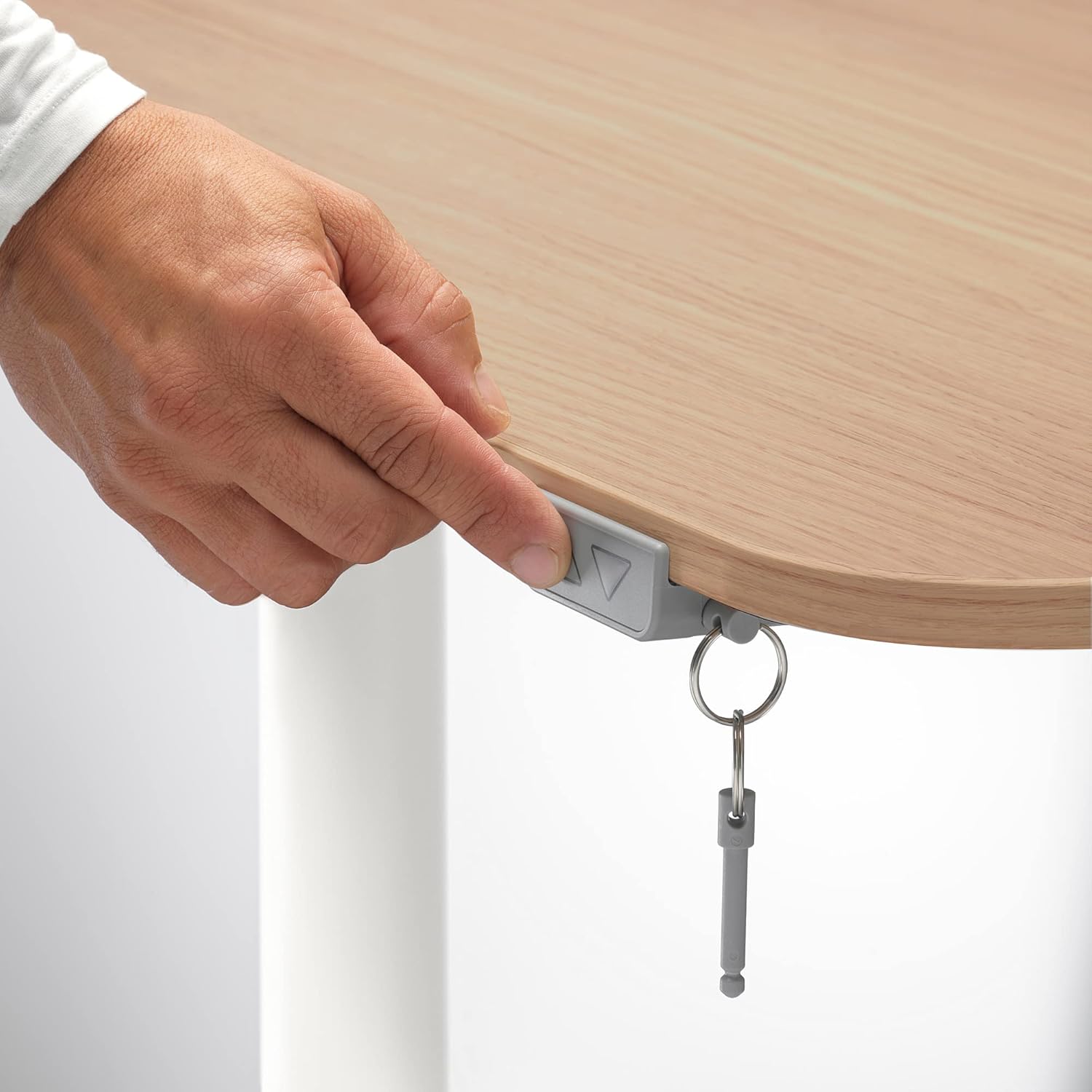 Underside of IKEA BEKANT desk showing cable management net