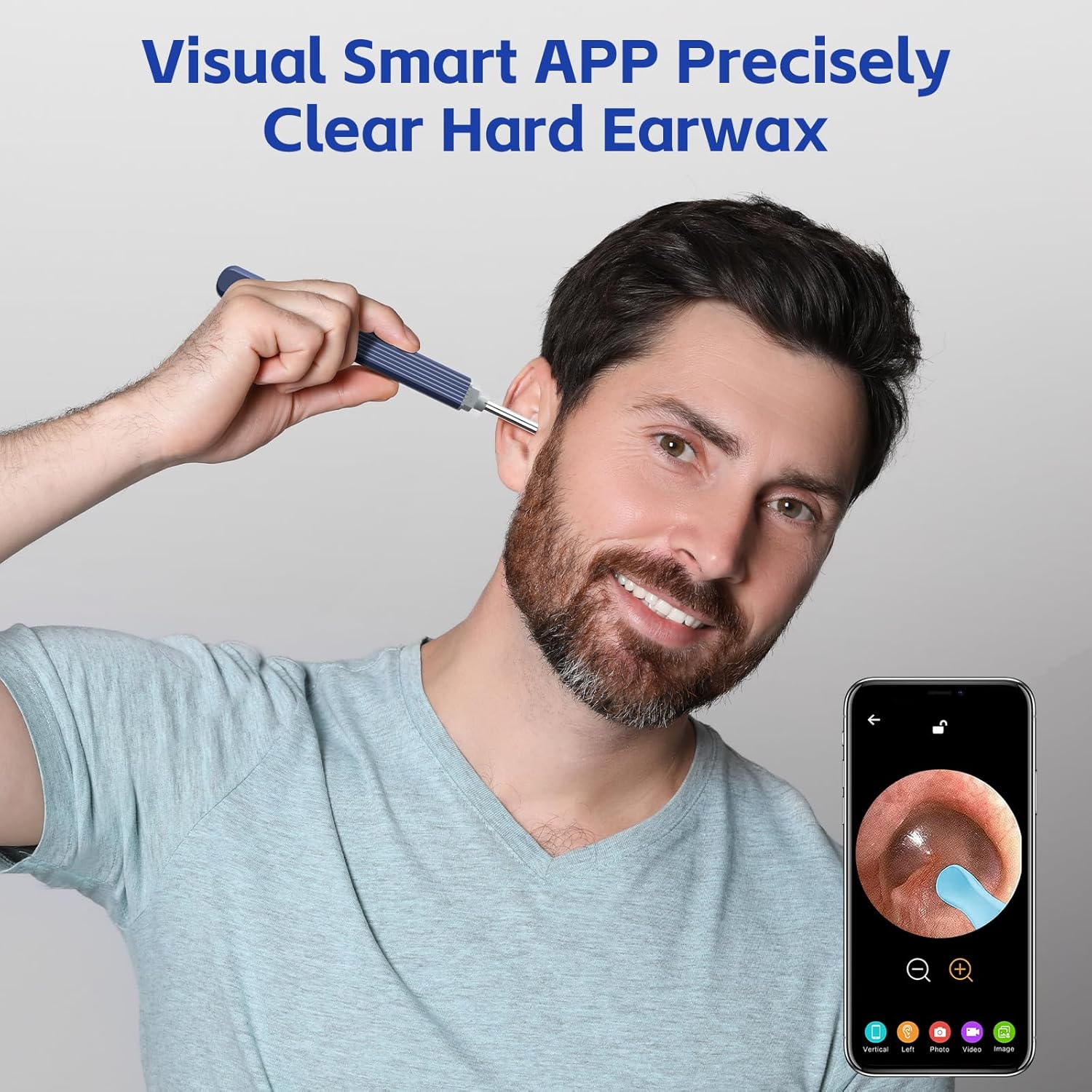 Man using the visual ear wax removal tool while viewing the ear canal on a smartphone screen