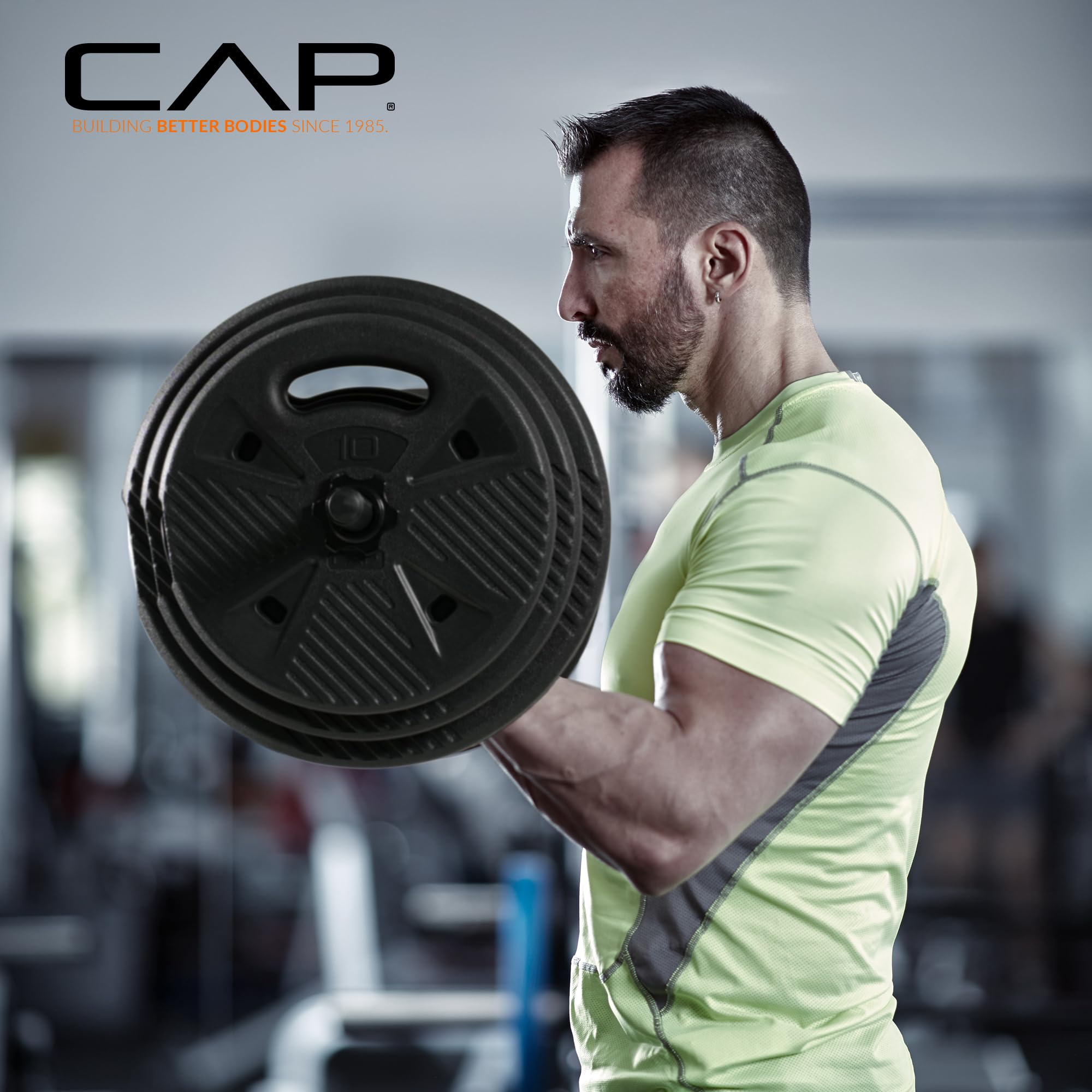 Condition photo showing New/Like New for cap threaded barbell set with 100 lb cement grip plates | 47" threaded bar, 25lb / 15lb / 10lb grip plates, star collars, home gym weight set for strength training