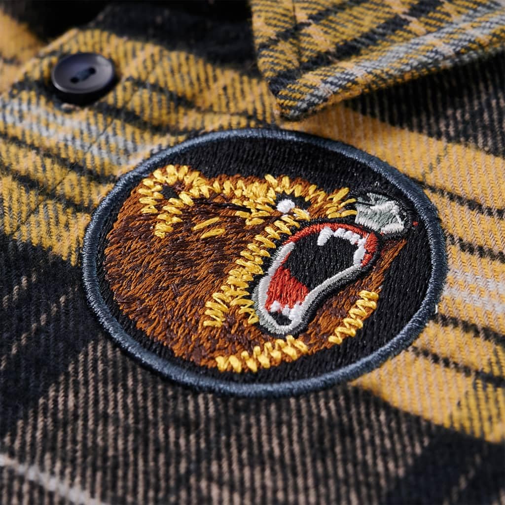 Camisa infantil a cuadros amarillo y negro de 100% algodón con cuello puntiagudo, mangas largas, parche bordado de oso, filas de botones, transpirable y cómoda para el día a día de los niños