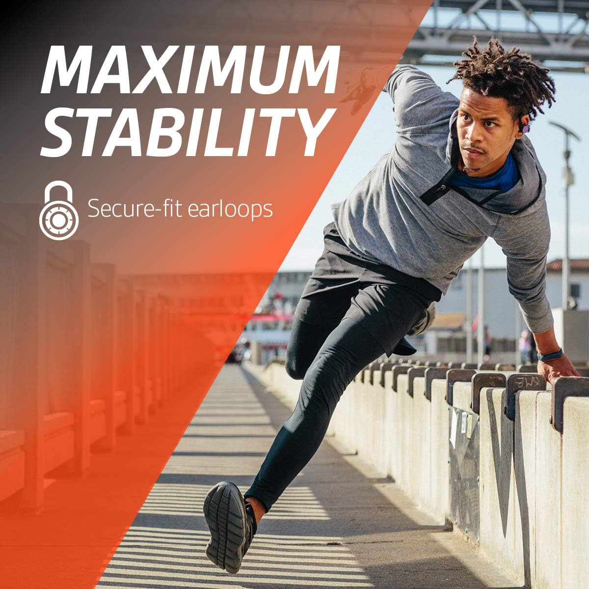 Plantronics BackBeat Fit 3100 True Wireless Earbuds in grey, covered in water droplets, emphasizing their sweatproof and waterproof design.