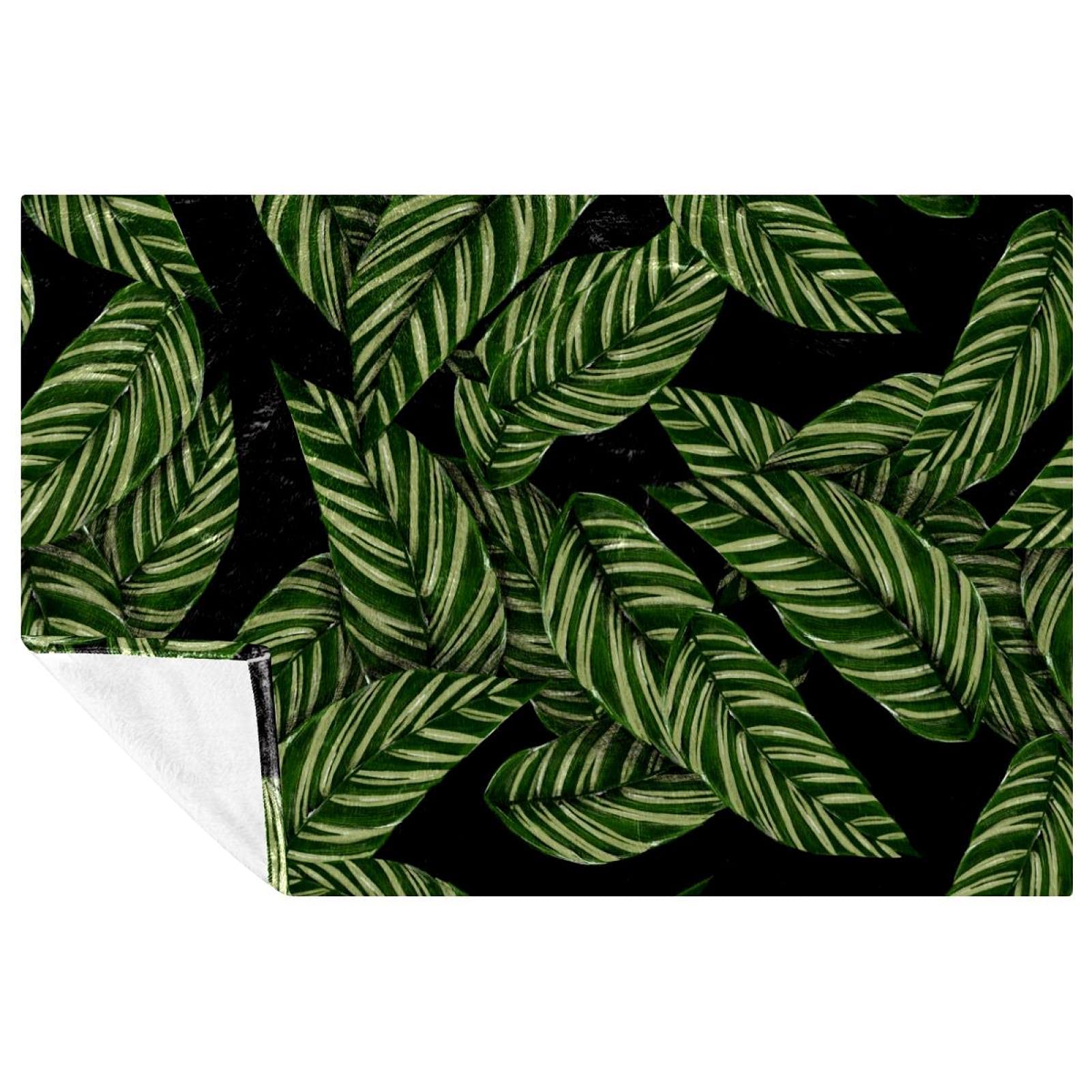 Couverture douce anti-froid feuilles tropicales pour réchauffer vos soirées canapé