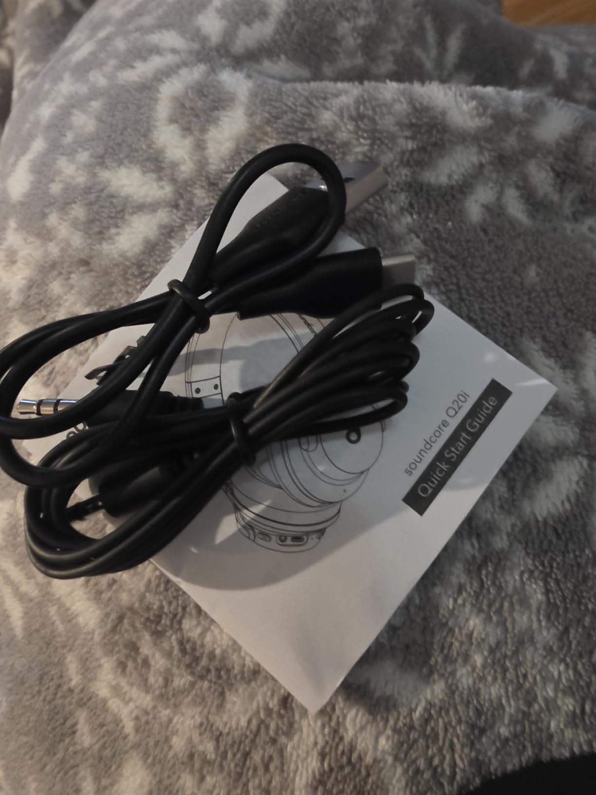 Soundcore Q20i unboxed showing included cables