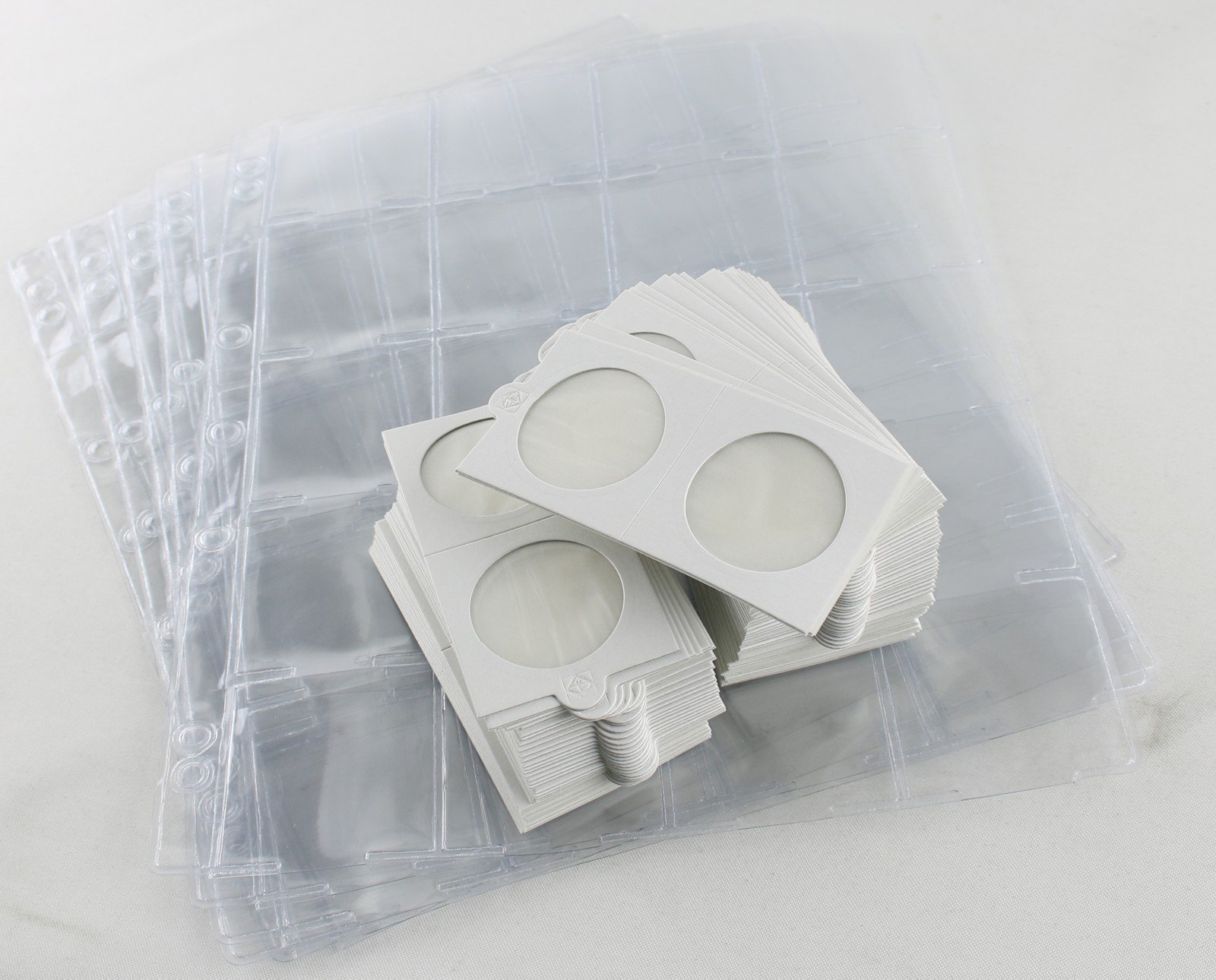 5 pages of coin album pages with 100 x self adhesive coin holders 30mm