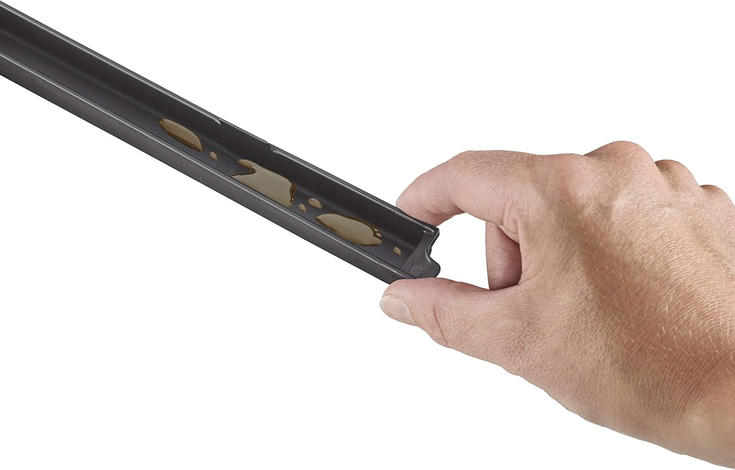 Hand holding the removable drip tray of the CASO VRH 790 advanced Pro Vacuum Sealer, showing accumulated liquid