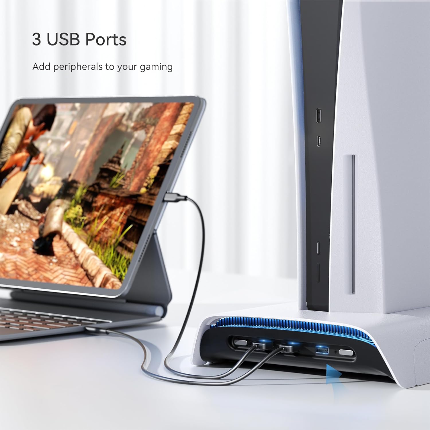 A PS5 console on the stand with a tablet connected to one of the three front-facing USB ports on the stand. The ports are illuminated with blue light.