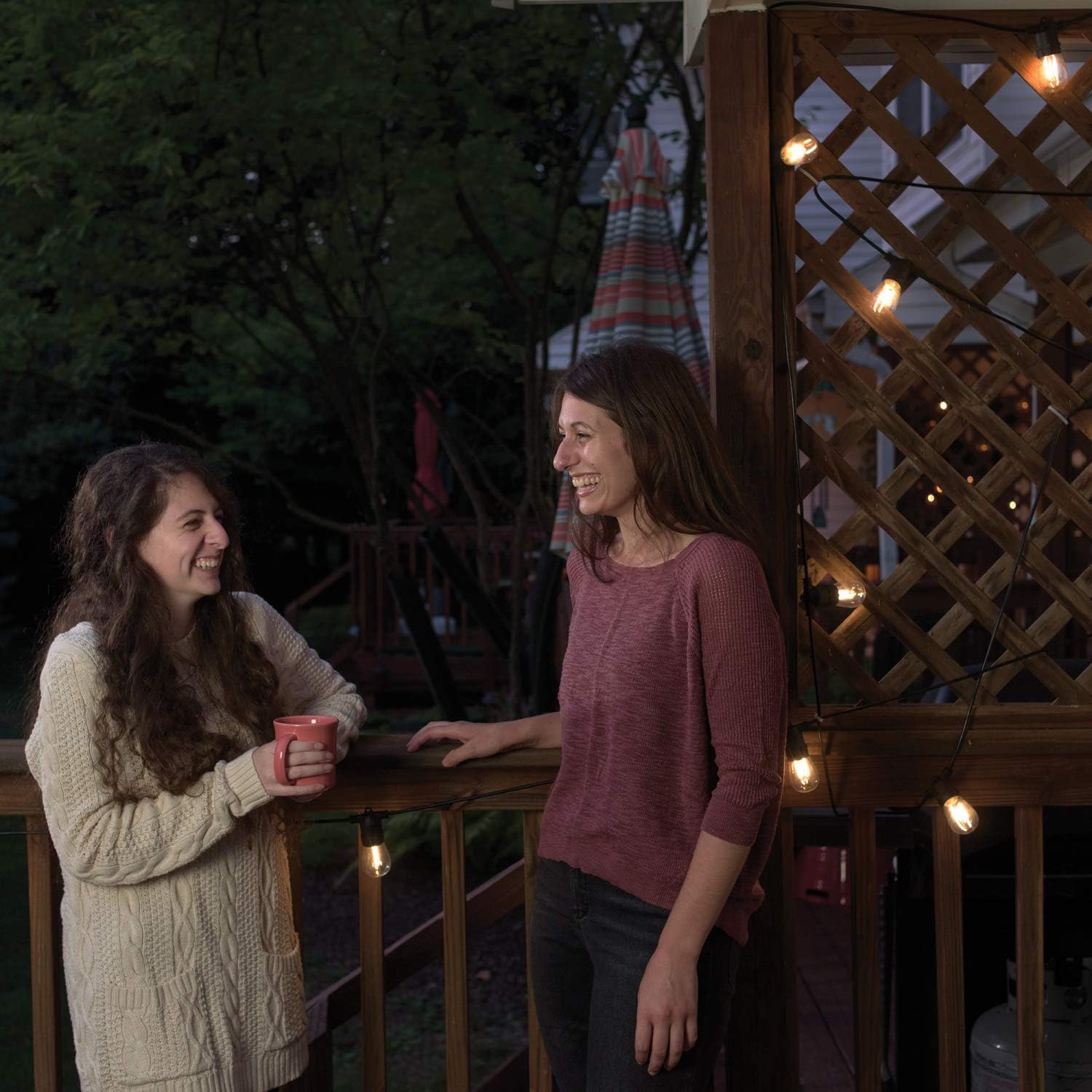 Mr. Beams string lights illuminating a deck at night