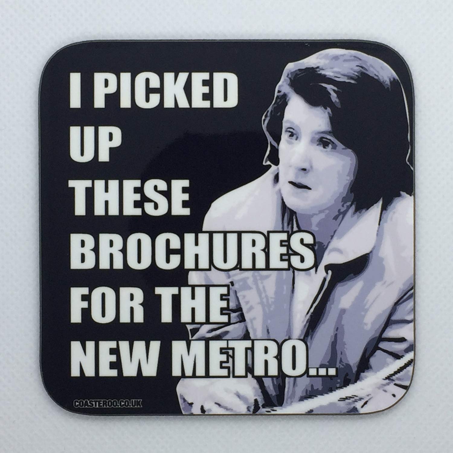 Coasteroo Black Brochures For The New Metro - Lynn From I'm Alan Partridge - Drinks Coaster - Hardboard - 9Cm X 9Cm - Gloss Finish