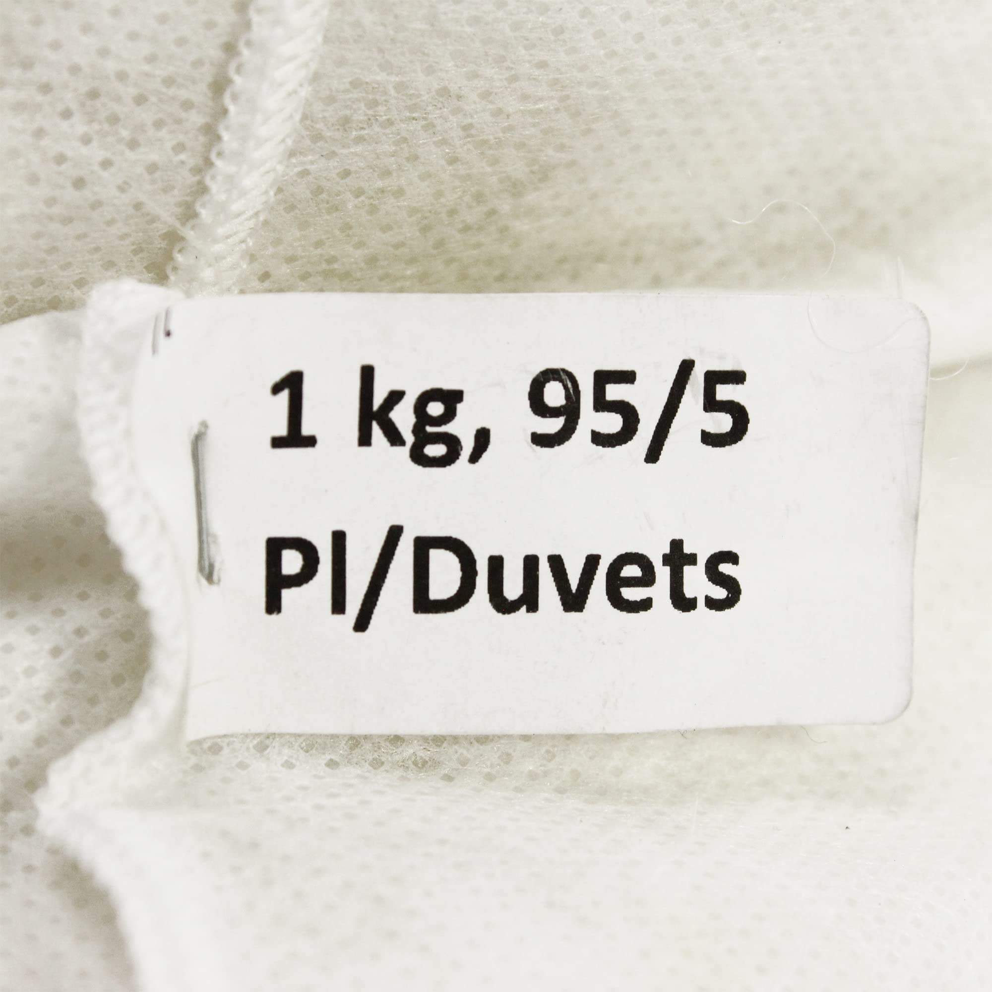 Relleno de 95 % de plumas de pato y 5 % de plumón, bolsa de 1 kg.