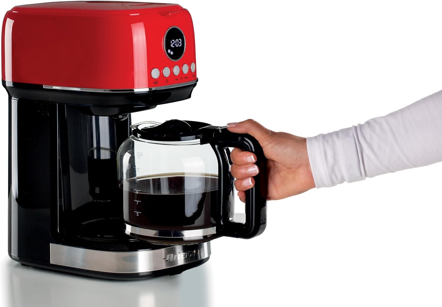 A hand removing the glass carafe from the Ariete 1396 Filter Coffee Machine.