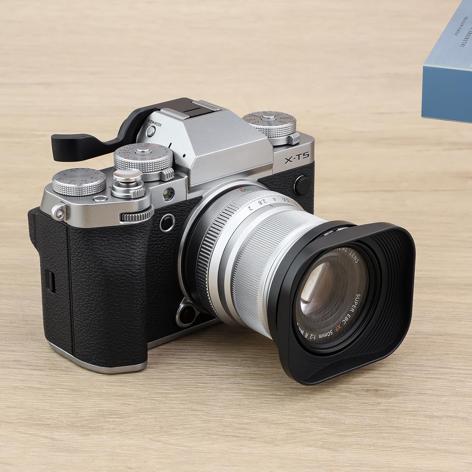 Haoge LH-X50 lens hood attached to a silver Fujifilm X-T5 camera with a Fujinon XF 50mm F2 R WR lens, viewed from the side.