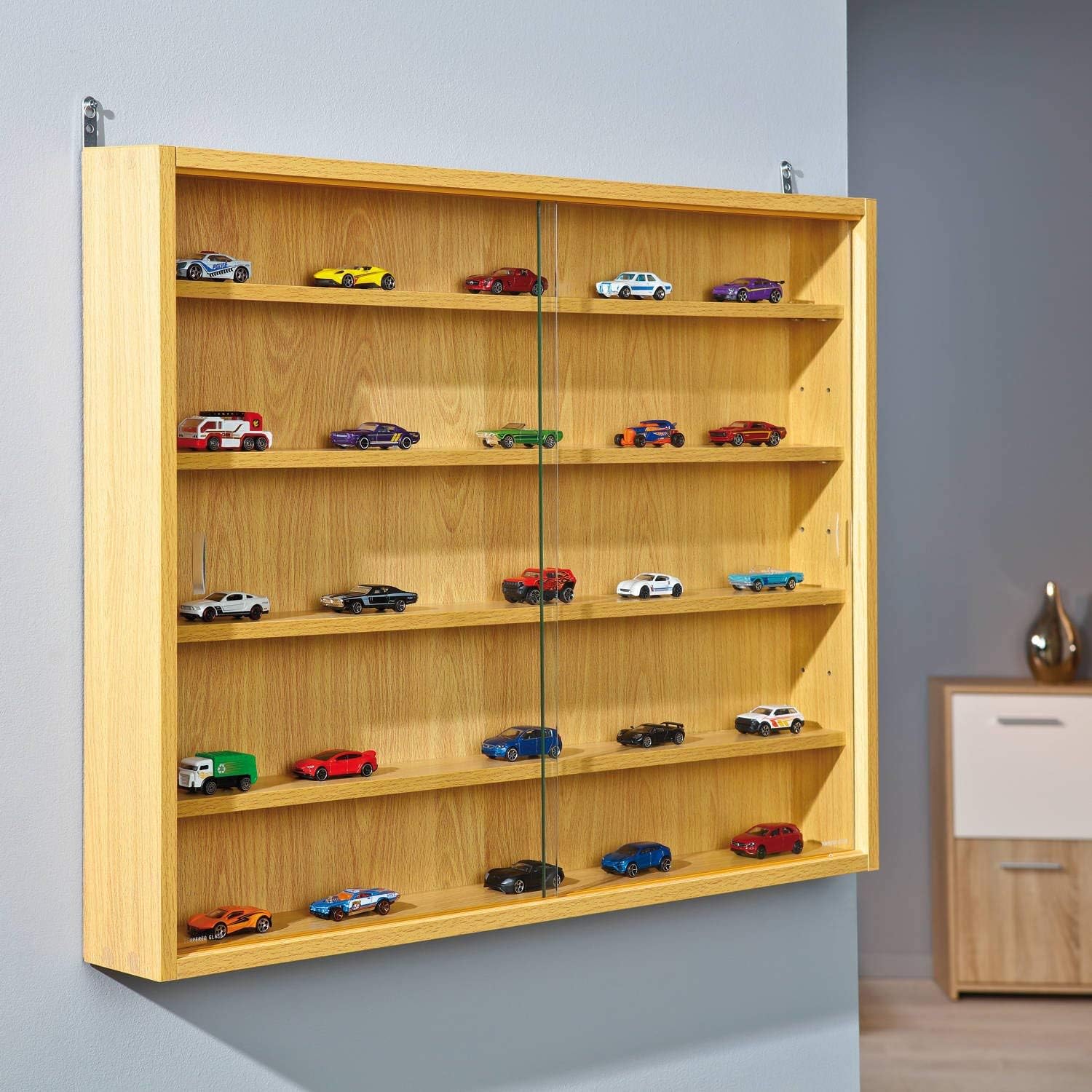 Interlink Display Cabinet Acquario mounted on a wall, filled with small collectible cars