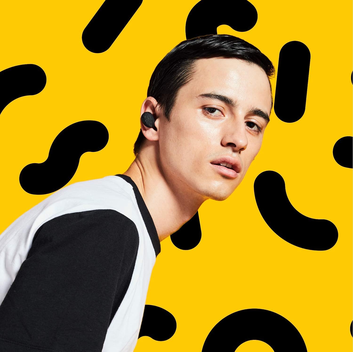 Man wearing JAM HX-EP900BK earbuds