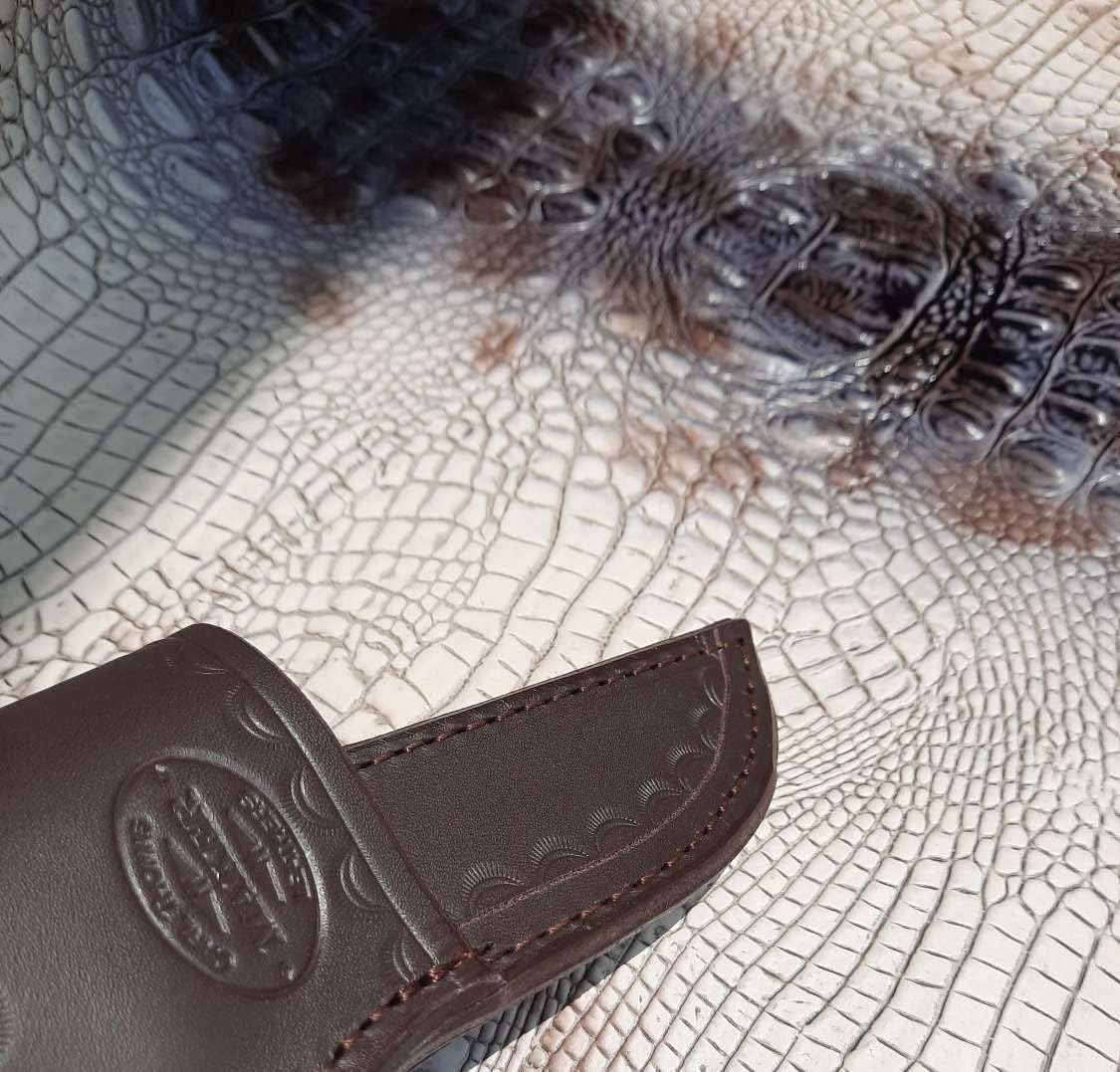 Custom Cross Draw Knife Sheath for Buck 102 Knife. The Sheath Is Made Out of 10 Ounce Water Buffalo Hide Leather the Leather Is Soft Pliable and Very Durable. This Sheath Can Be Worn on the Right or Left Hand Side. It Is Died Dark Brown with Border Tooling. This Is for Sheath Only Knife Not Included.