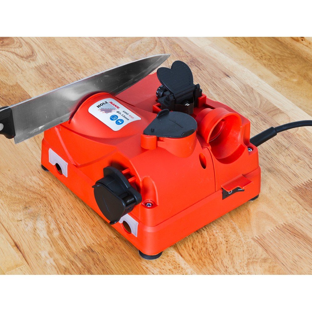A kitchen knife being sharpened in the Holzmann USG 950 sharpener