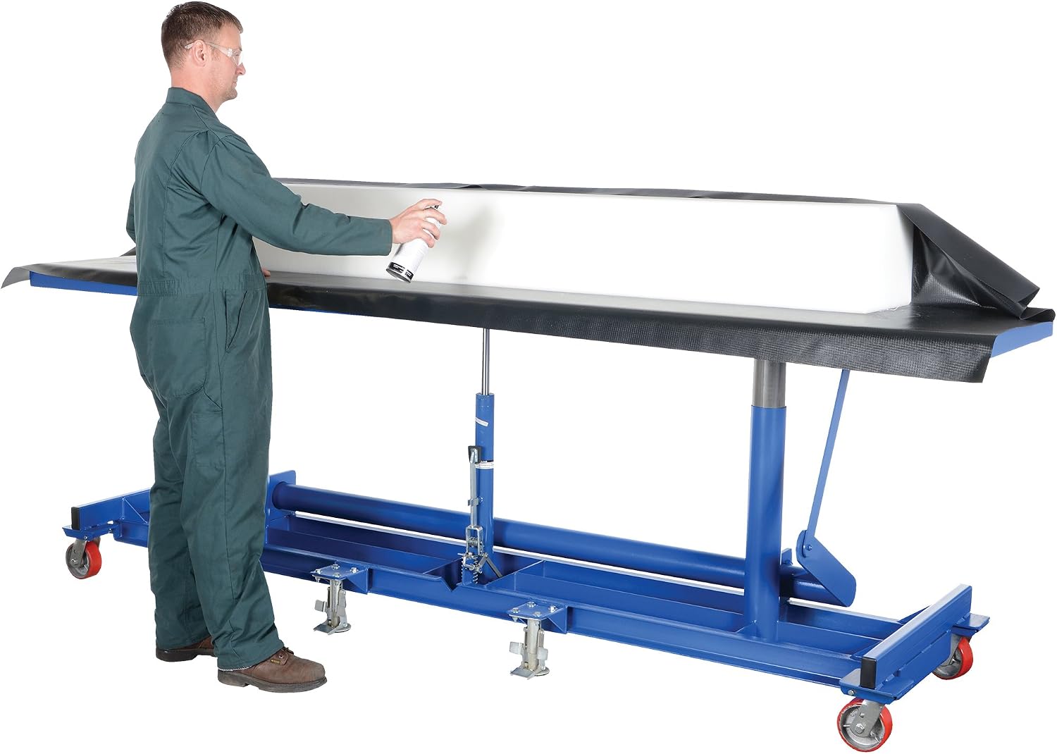 Worker adjusting the height of the Vestil 120x30 Ergonomic Long Deck Cart 2k with a long white object on top