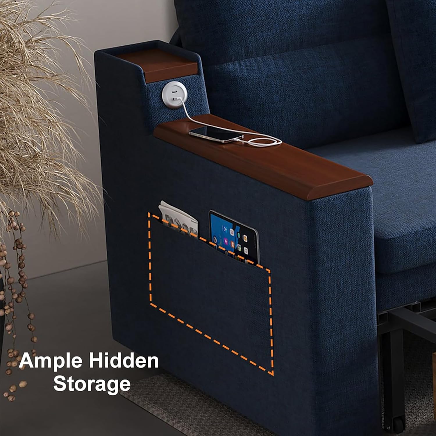 Close-up of the side storage pockets on the sofa armrest, holding a tablet and magazines.