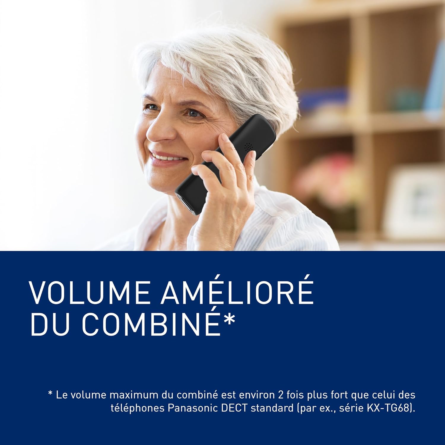 Elderly woman talking on Panasonic phone, illustrating enhanced volume