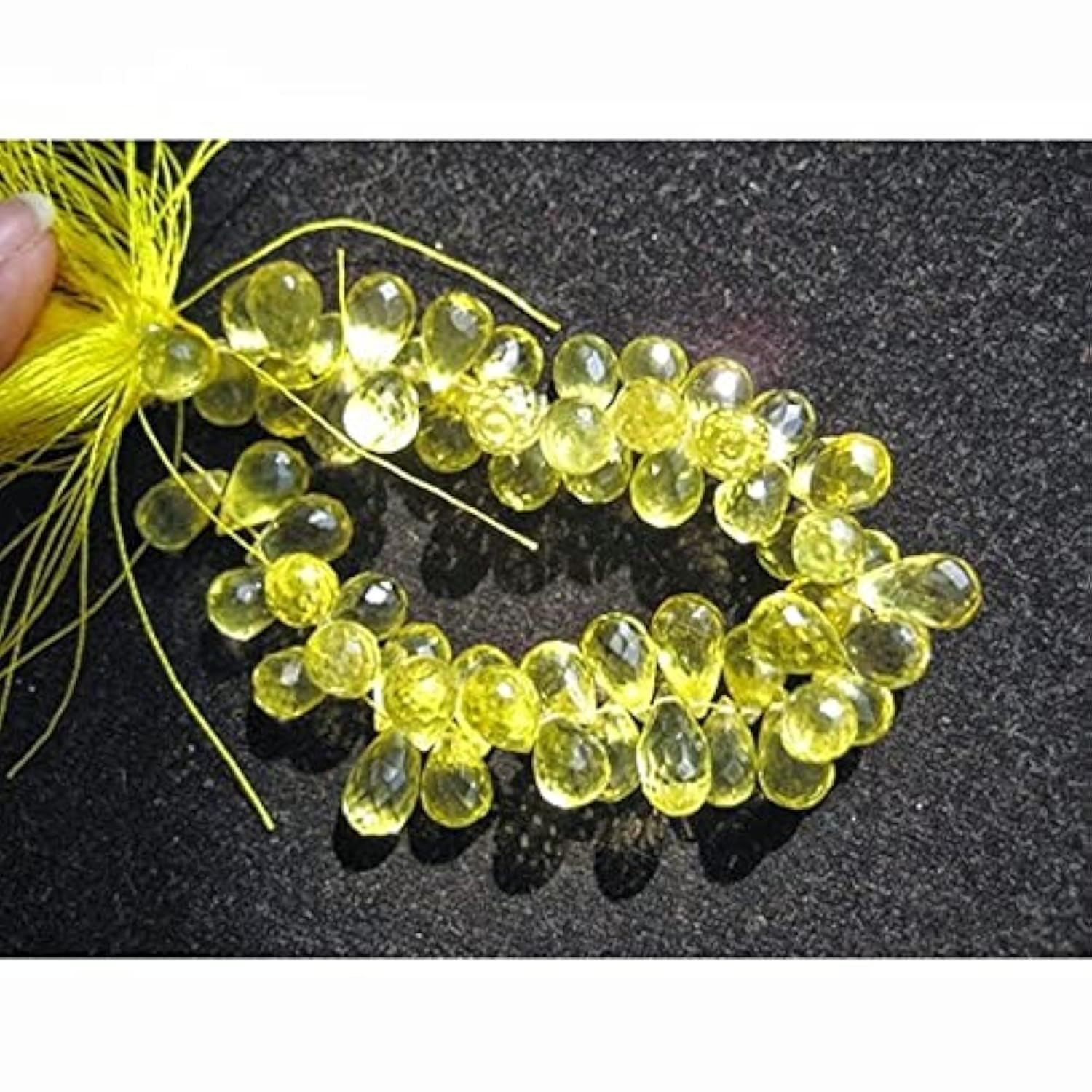 Quartz citron briolette facetté 10x6mm contre les perles ternes de bijoux