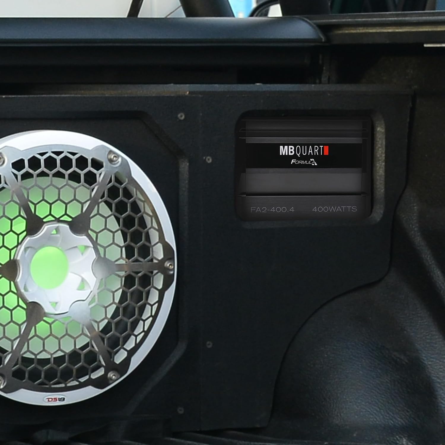 MB Quart FA2-400.4 Amplifier installed in a vehicle with a subwoofer