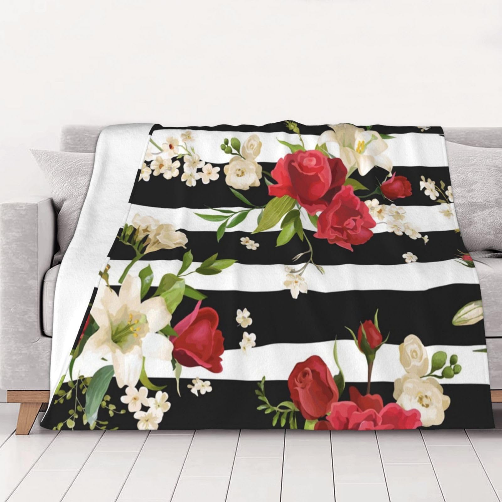 Couverture flanelle rayures noires blanches pour vos soirées canapé