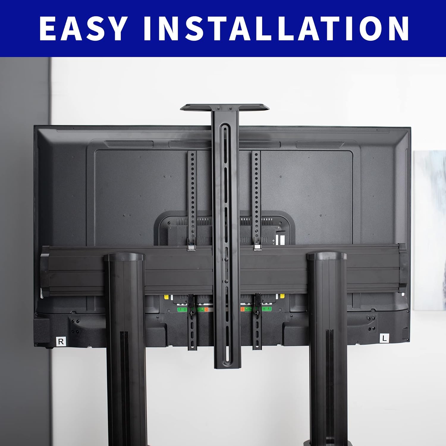Image showing the back of a TV mounted on the VIVO cart, highlighting the mounting plate