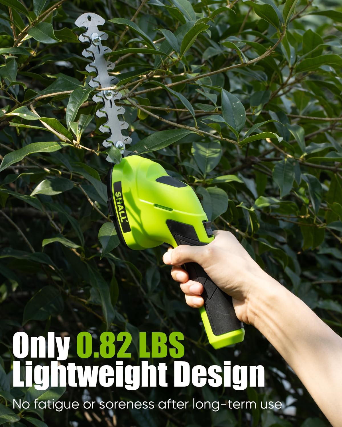 Hand holding the SHALL 2-in-1 tool to trim a hedge