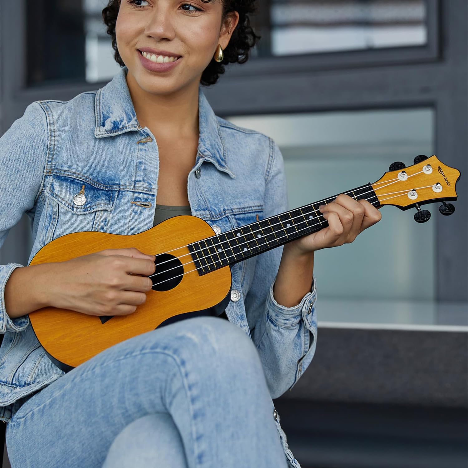 Amazon Basics Concert Size Ukulele Kit, Nylon Strings for warm, mellow and bright tones | Basswood Body | ABS back | Matte Finish, with Bag, Picks, Strap - Natural Brown - Image 5 thumbnail
