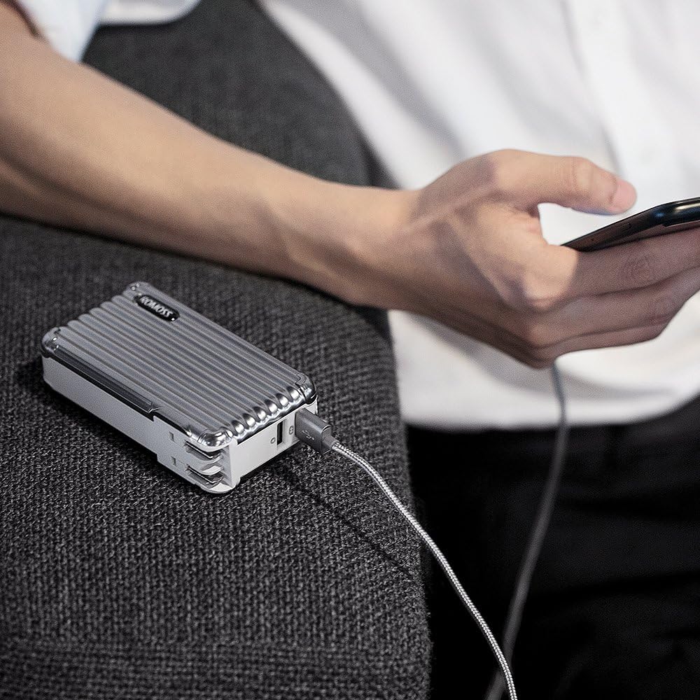 Person charging a smartphone using the ROMOSS UP10 power bank