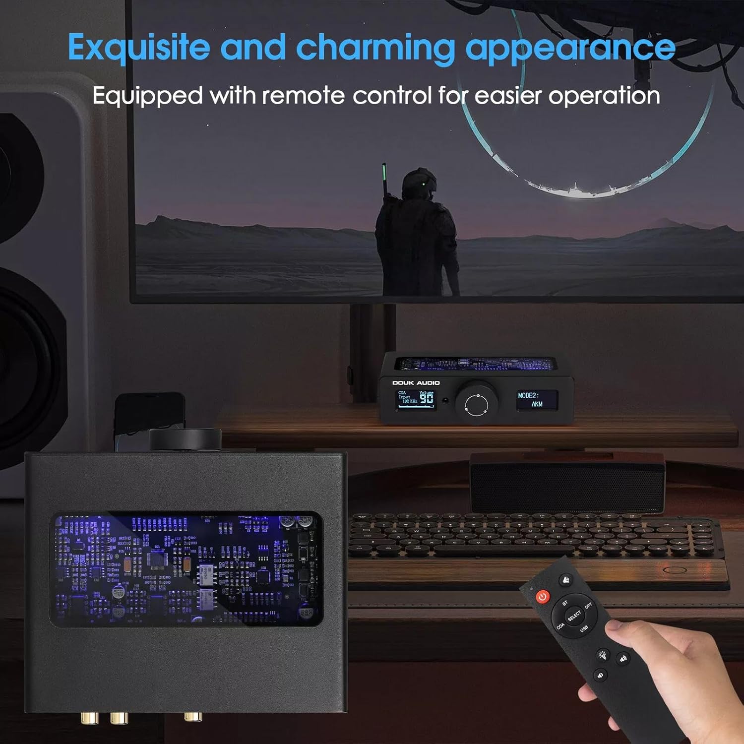 Douk Audio Q11 DAC on a desk with a remote control in hand, showing the glass top panel.