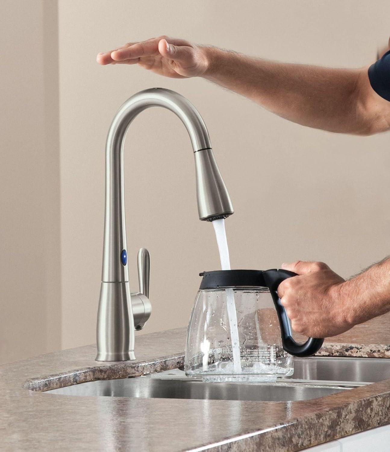 Man filling coffee pot using MotionSense faucet