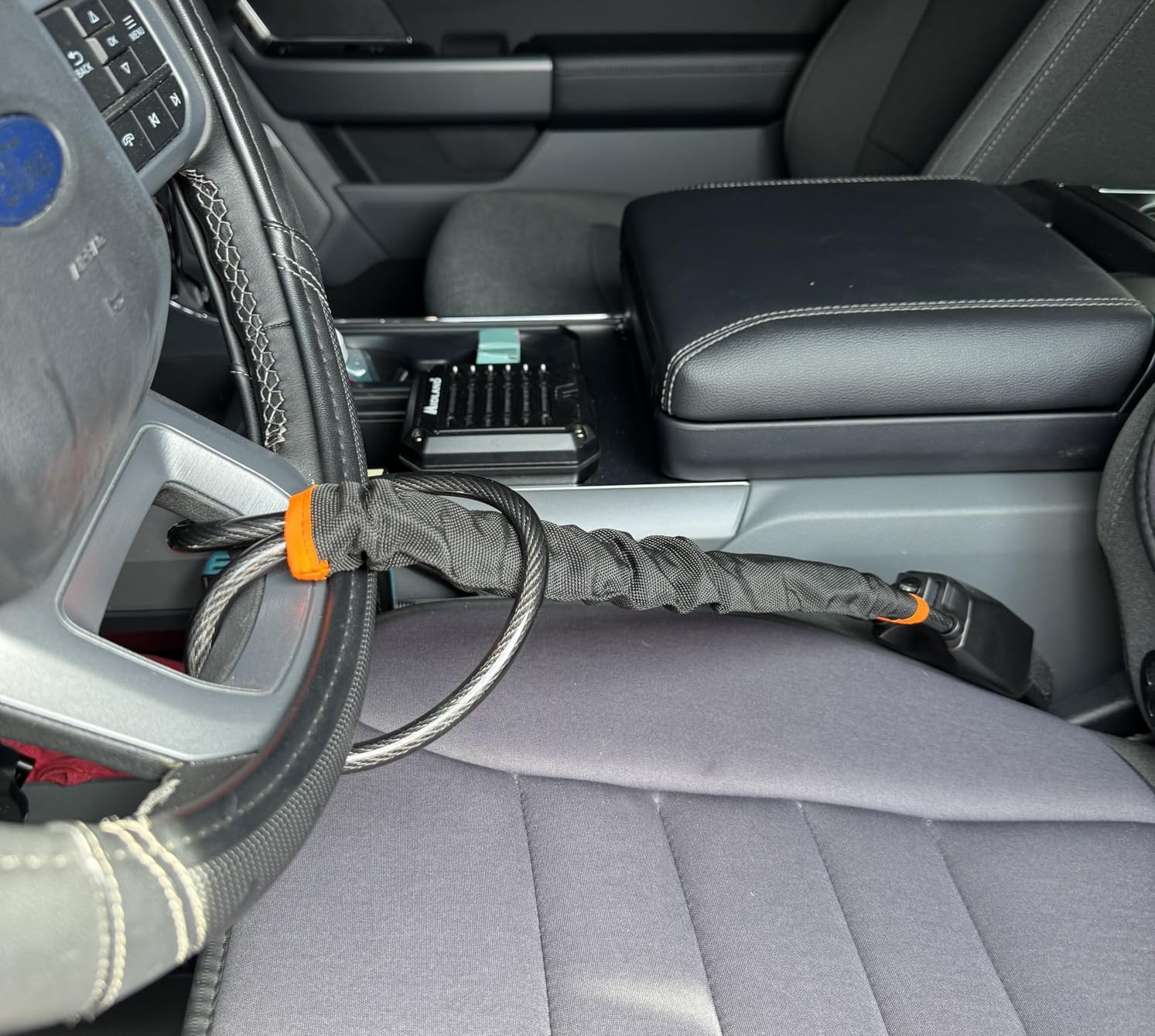 Steering wheel lock cable assembly