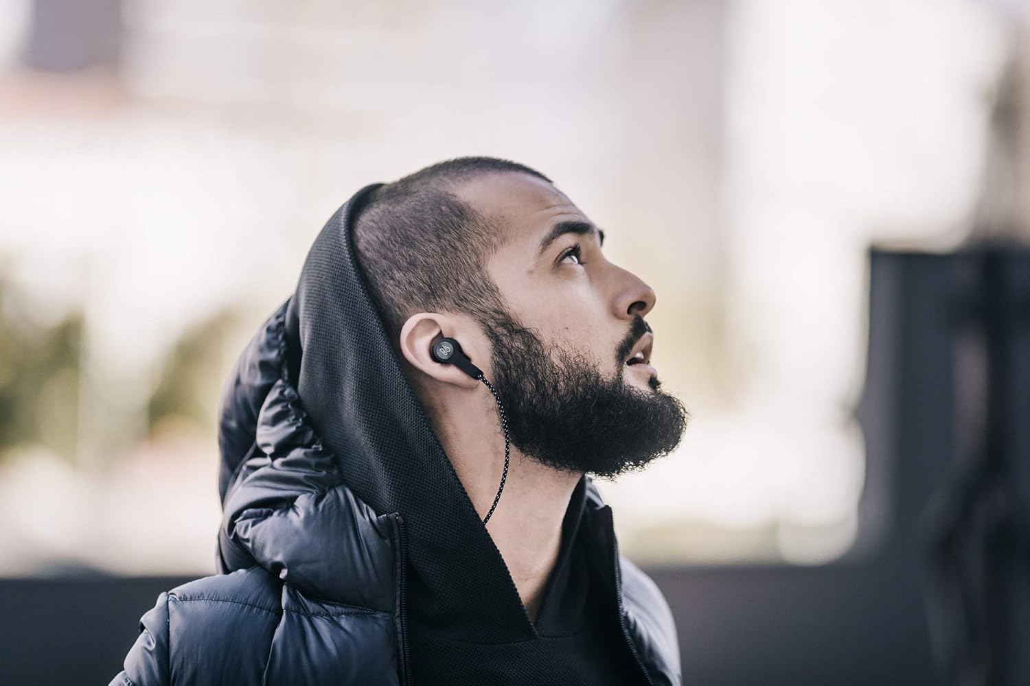 Person wearing Bang & Olufsen Beoplay H5 headphones