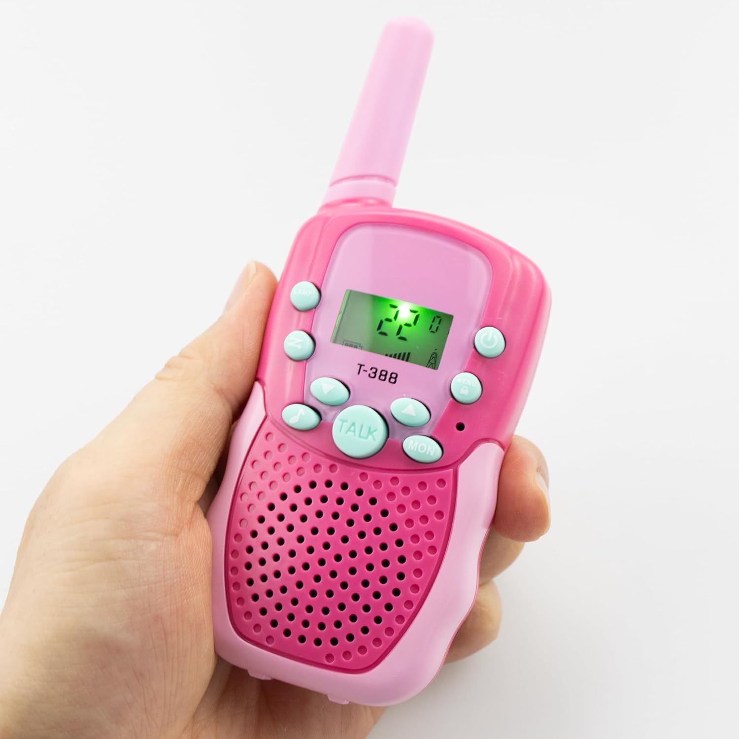A hand holding a pink T-388 walkie talkie, showing its compact size and button layout.