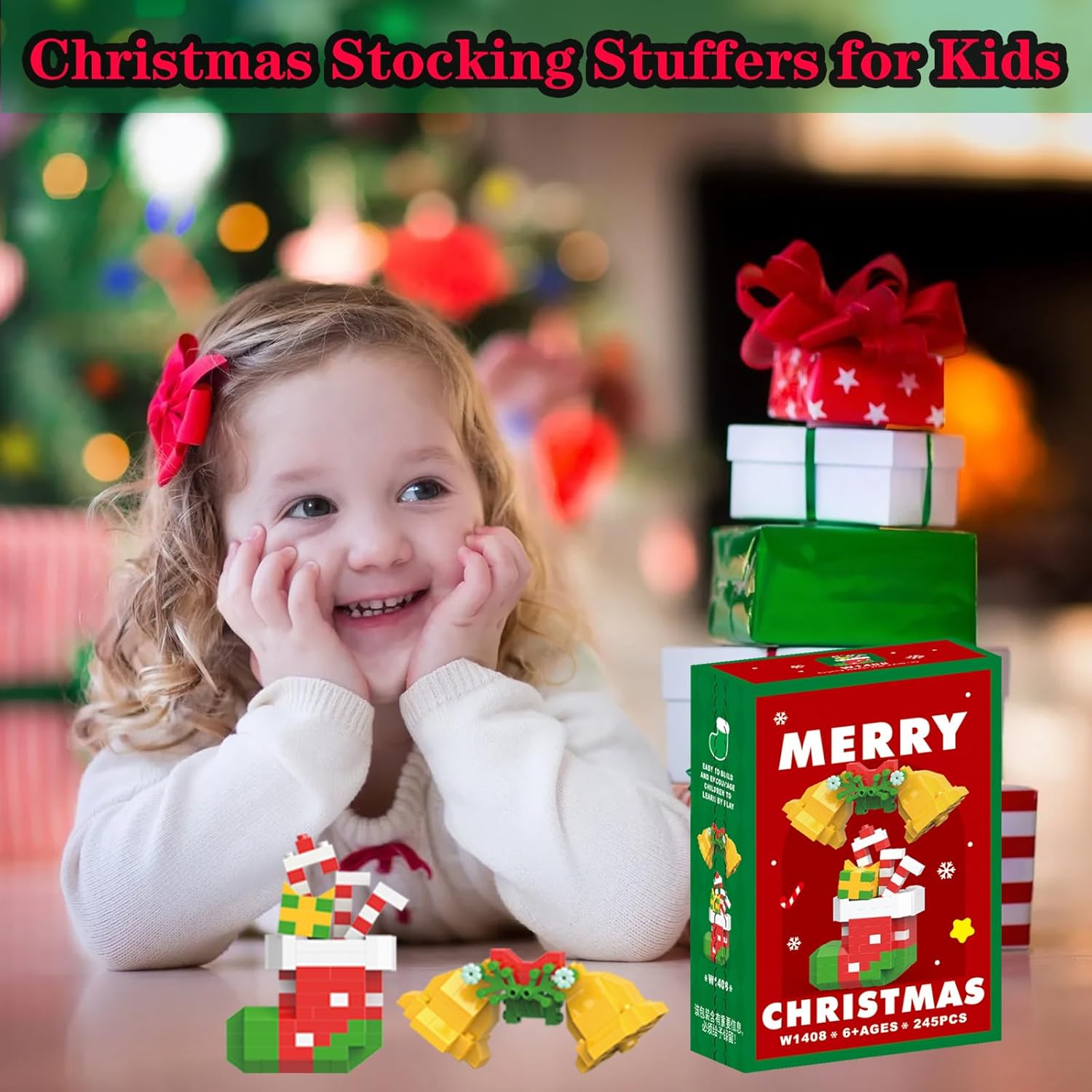 Child with the building block set box and assembled pieces