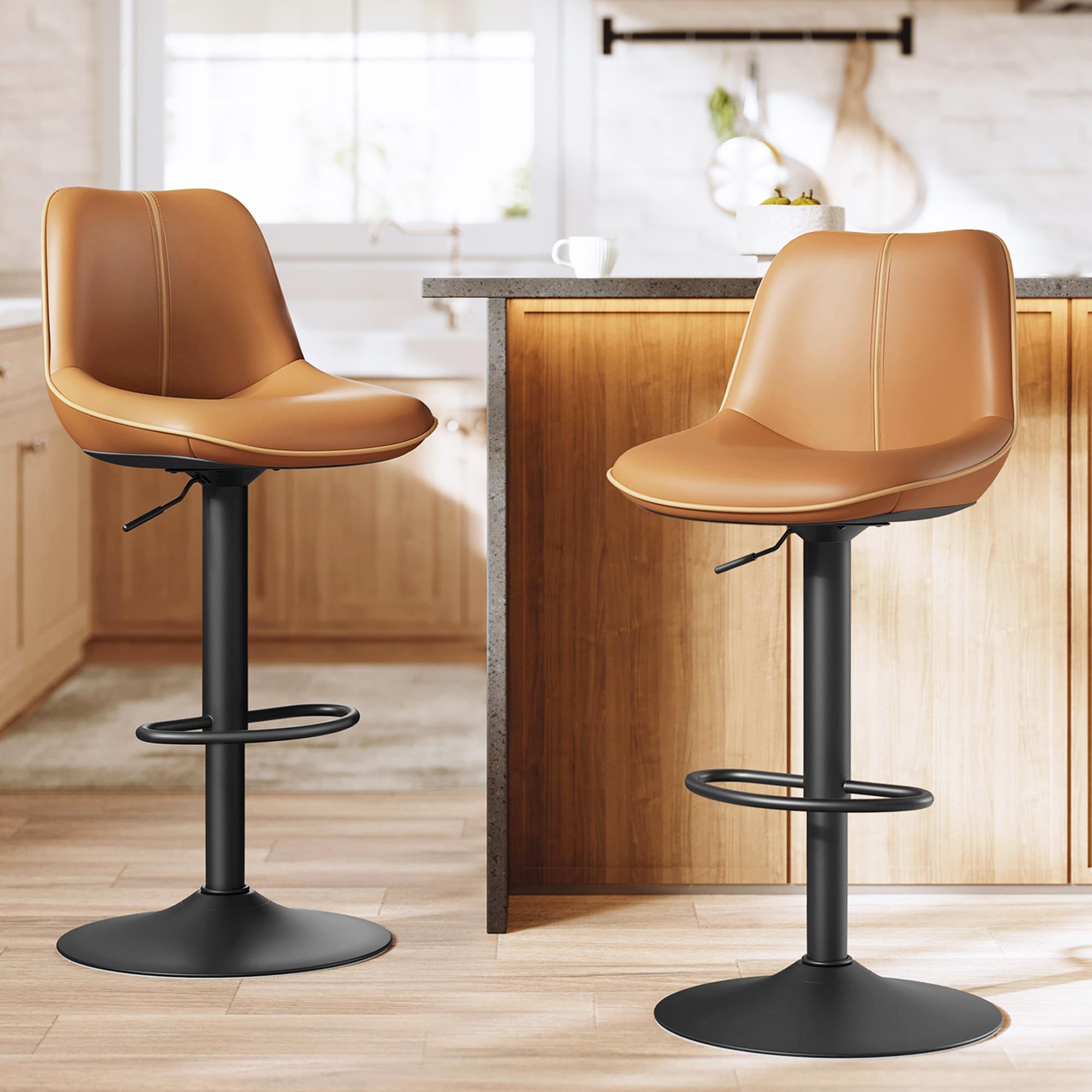 Two VASAGLE LJB168K01 bar stools with caramel brown PU seats and black metal bases in a modern kitchen setting.