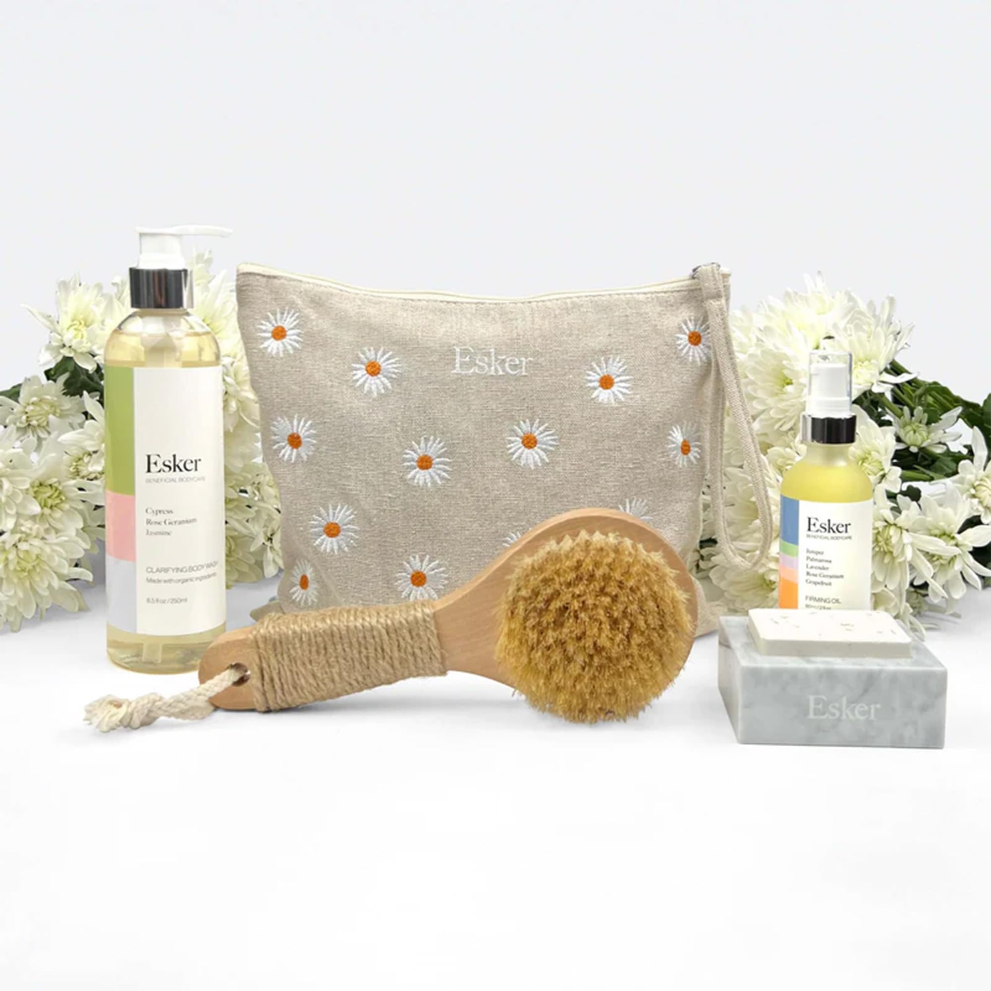 ESKER Everything Shower Gift Set Comes with our Dry Brush 2oz Firming Body Oil a Full Sized Clarifying Wash and our Aromatic Shower Steamer all Packaged in a Beautiful Floral Linen Pouch