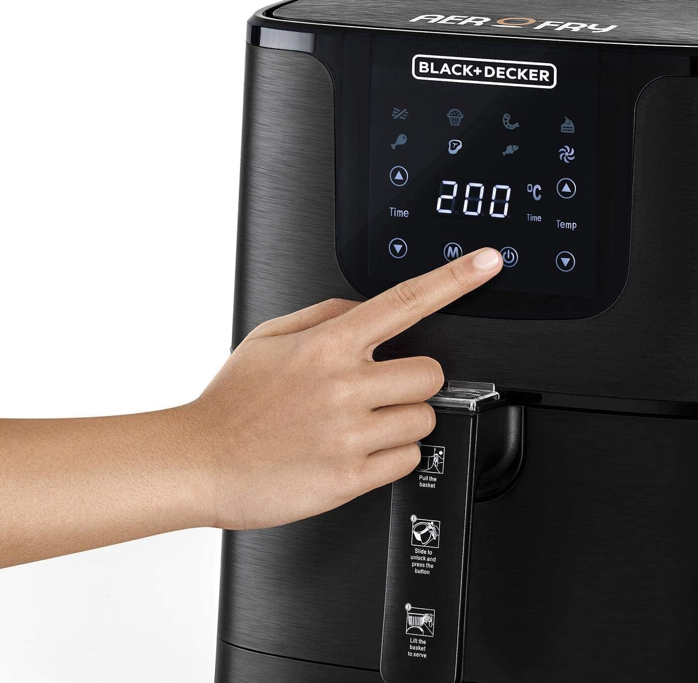 Hand pressing the power button on the BLACK+DECKER Digital Air Fryer's touch screen