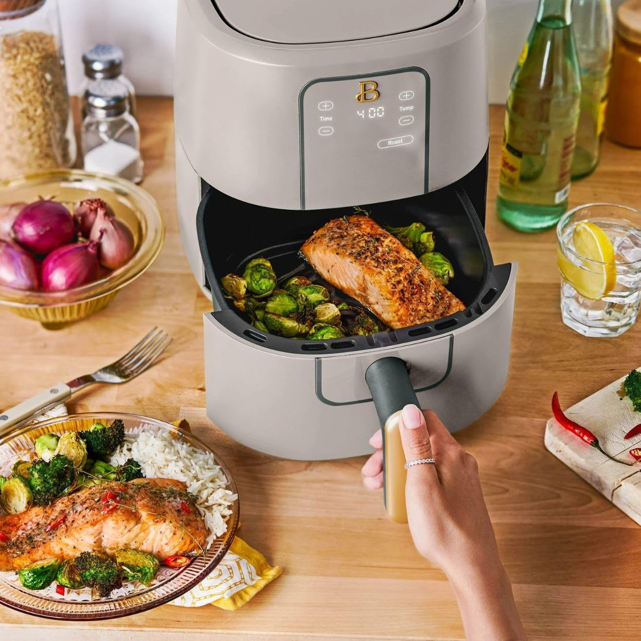 Beautiful 3 Qt Digital Air Fryer with a basket containing roasted salmon and brussels sprouts