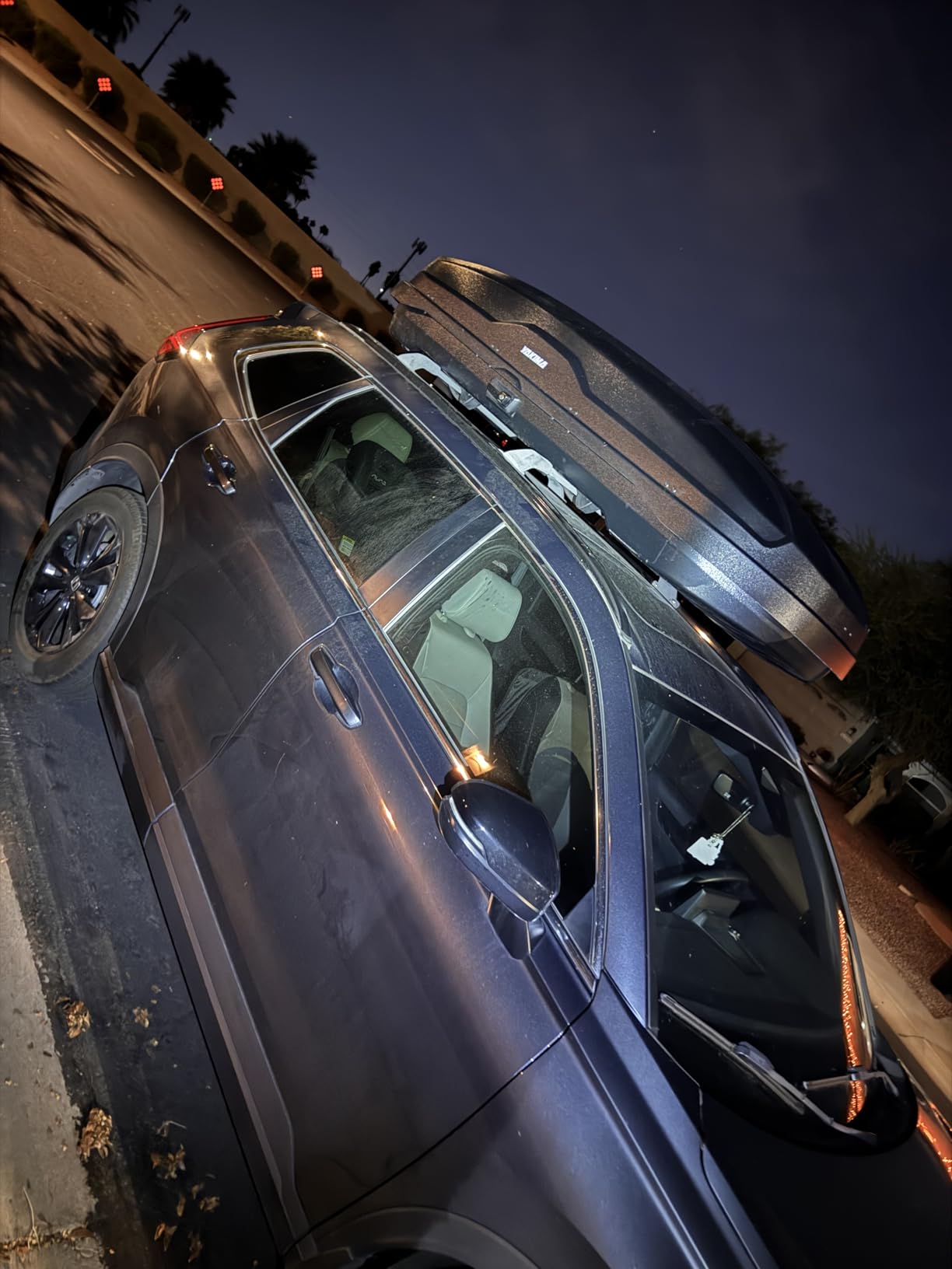 Yakima SkyBox NX 18 installation features including torque knob, SKS locks, and tie-down points