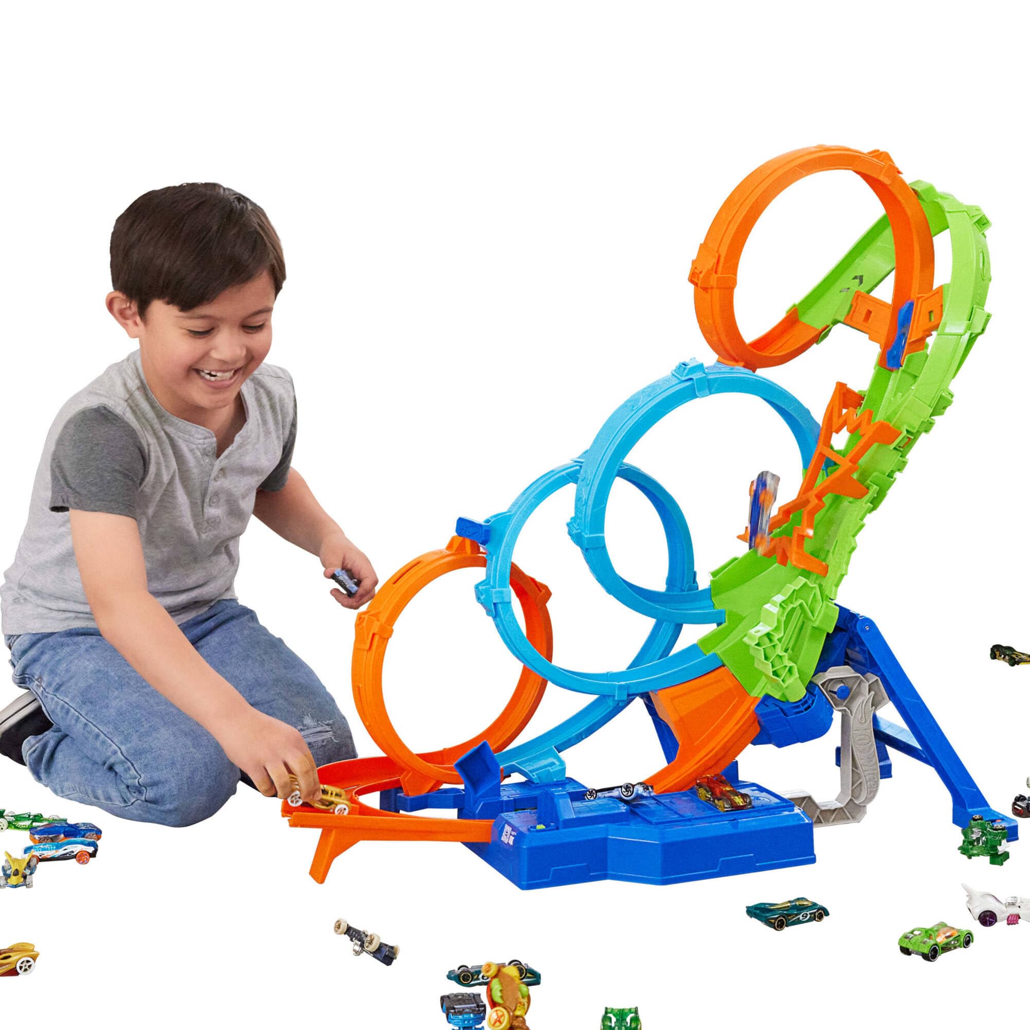 Hot Wheels Action Vueltas y choques desafiantes, Pista para Coches de Juguete Plegable con 4 loopings, Lanzador y 1 vehículo Die-Cast a Escala 1:64, Regalo para niños y niñas +5 años, HXT06