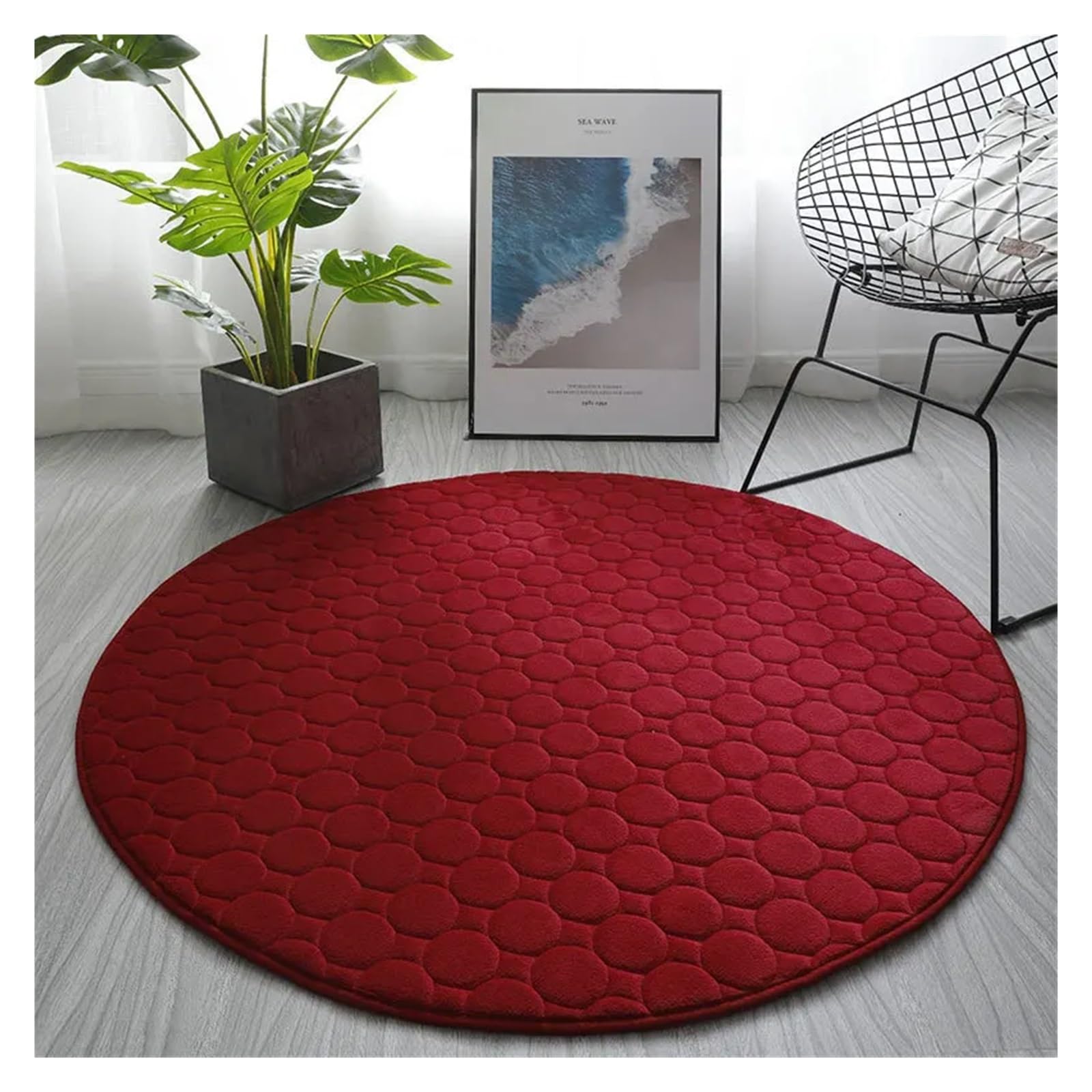 Tapis de sol rond rouge matelassé pour une chambre à coucher cocooning