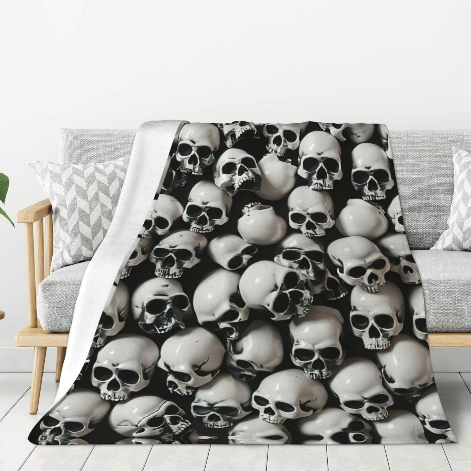 Couverture tête de mort en flanelle noire pour des soirées cocooning devant la télé