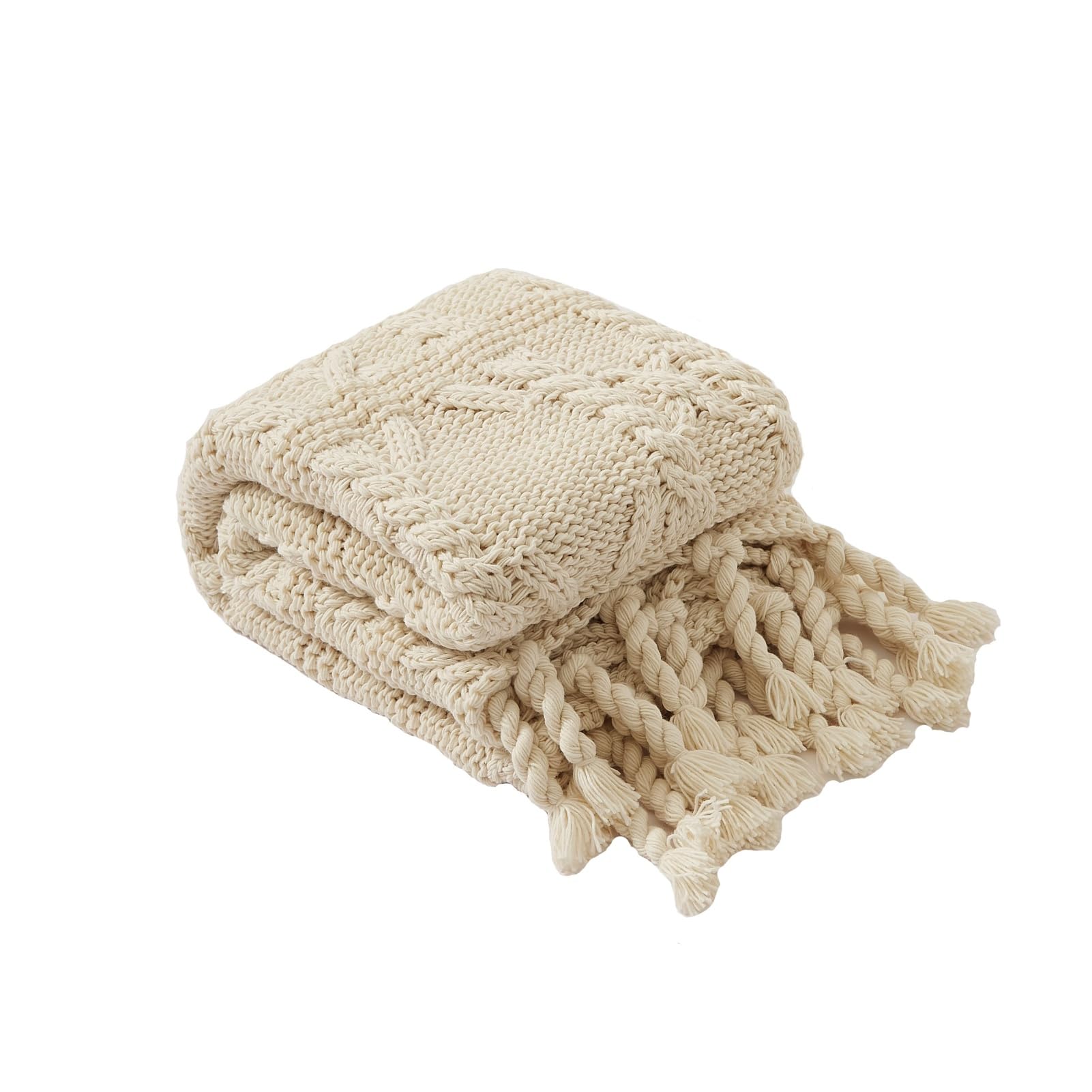 Couverture tricot torsadé beige pour des soirées cocooning au salon