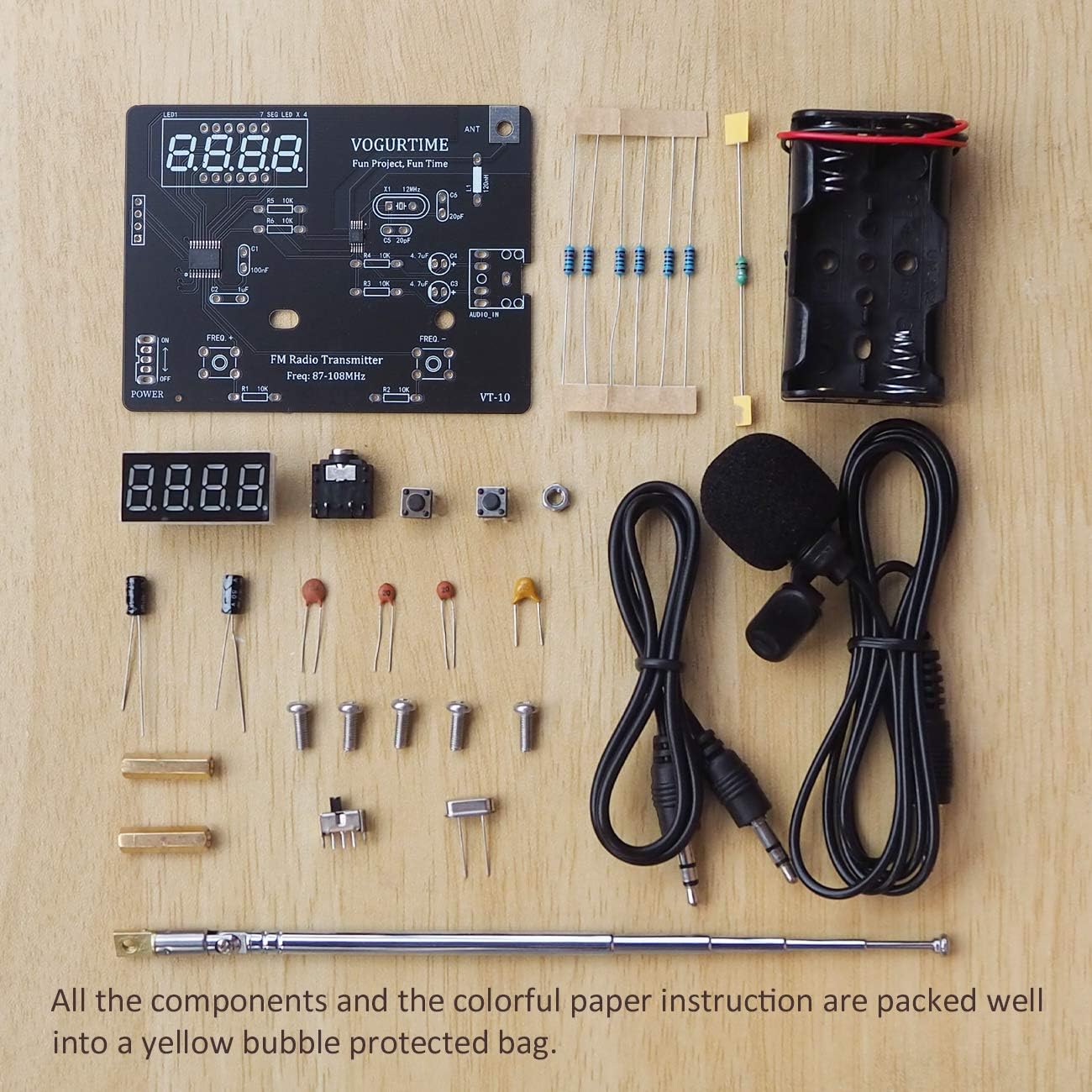 All components of the VOGURTIME FMT-VT10 FM Radio Transmitter Solder Project Kit laid out on a wooden surface.
