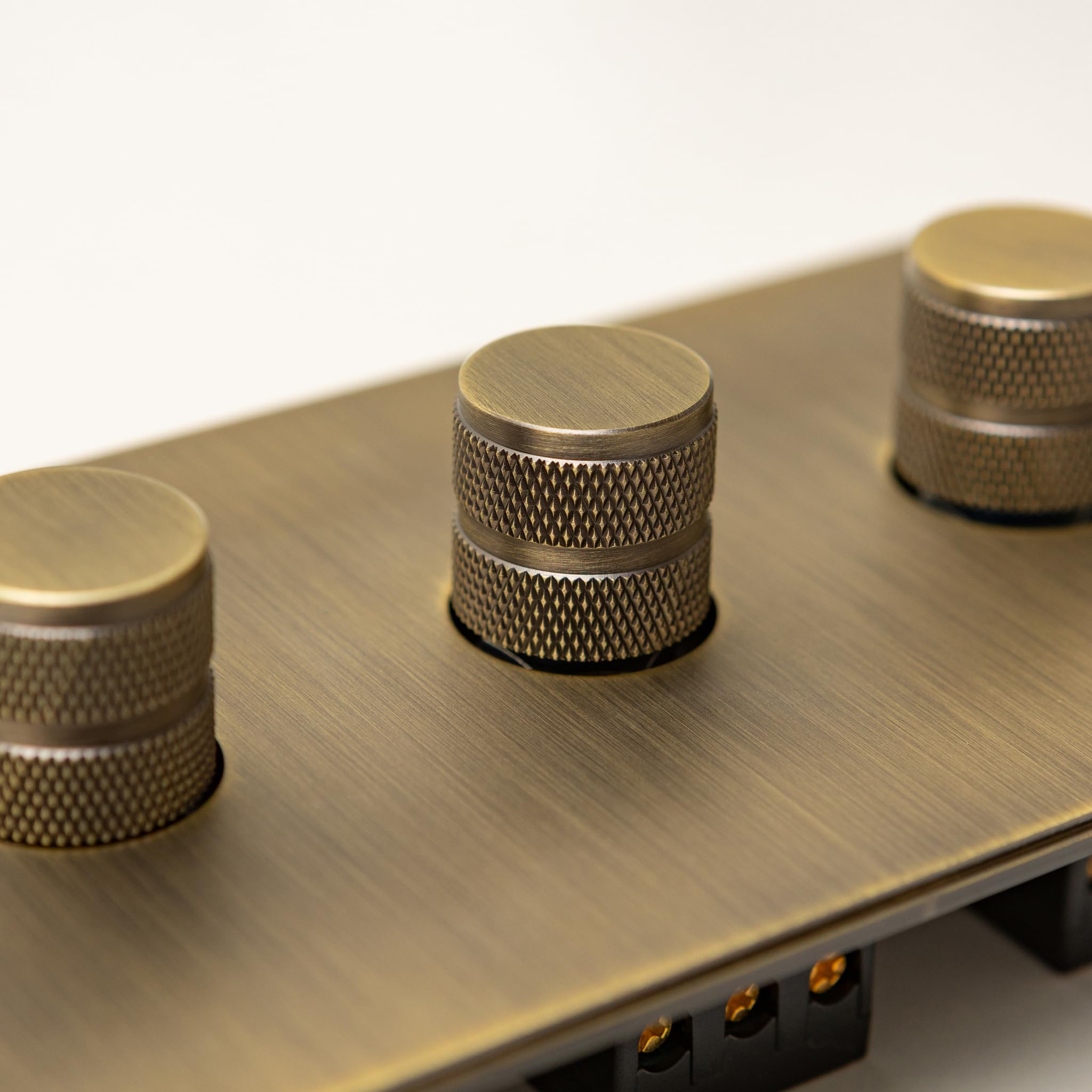 Foundry Series Knurled Toggle Switches and Sockets – Antique Brass (3 Gang Dimmer)