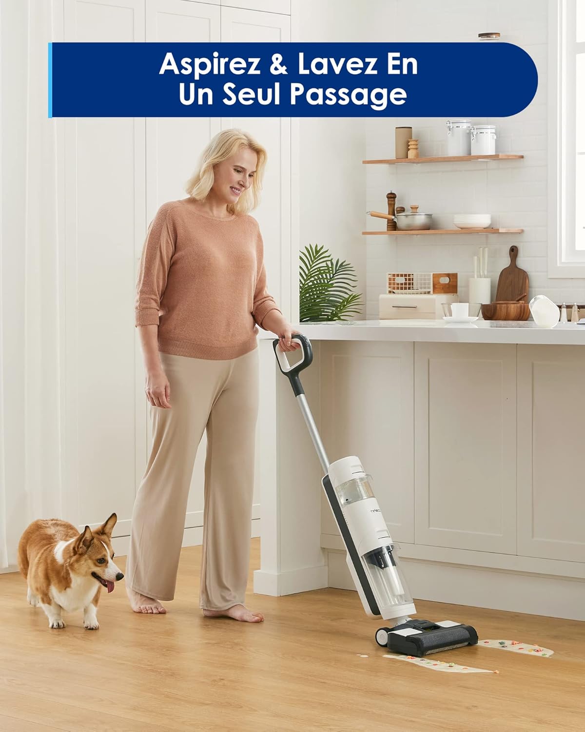 A woman cleaning a hard floor with the Tineco iFloor 3 Breeze Plus, with a dog nearby.
