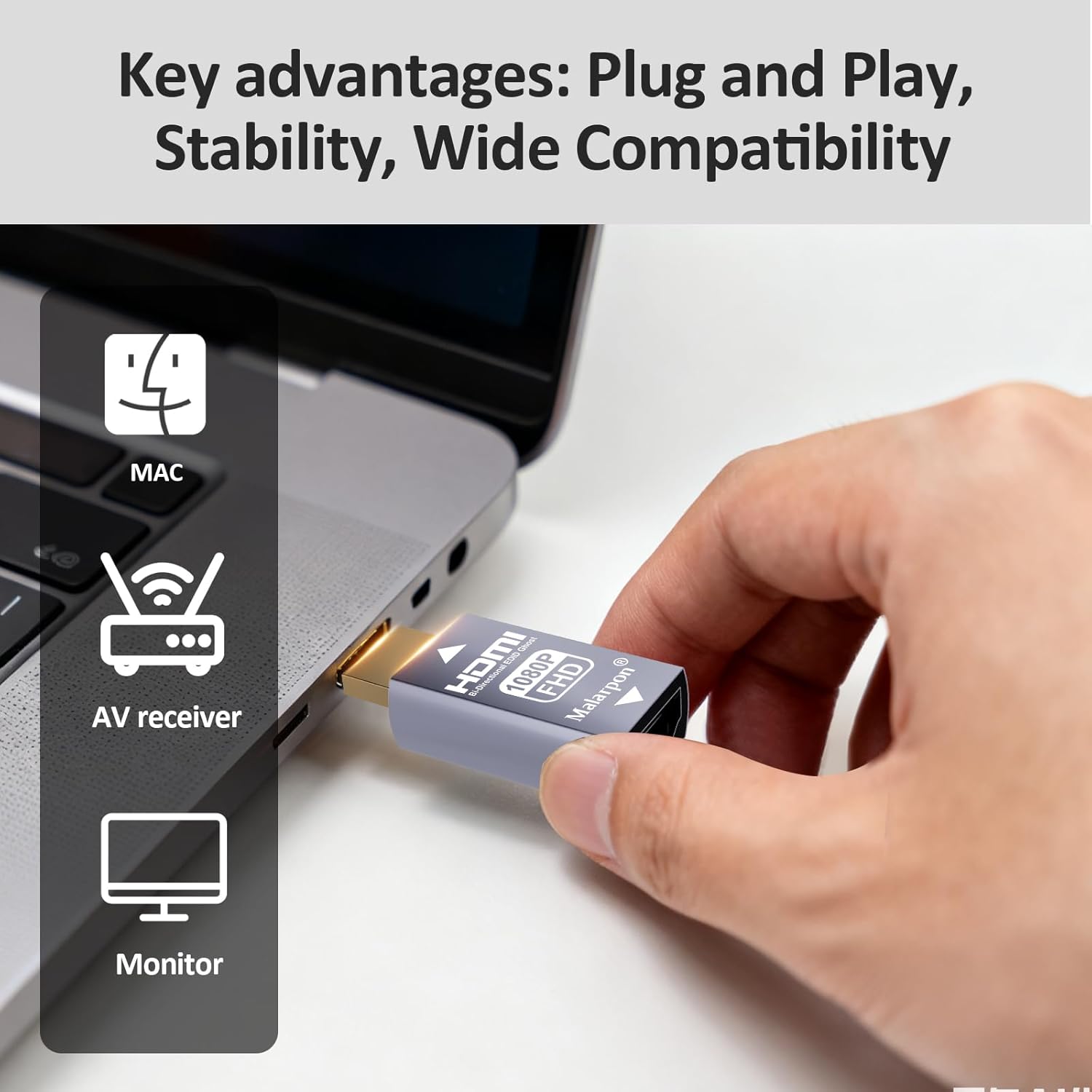 A hand plugging the Malarpon HDMI EDID Emulator into a laptop's HDMI port, illustrating plug-and-play setup.